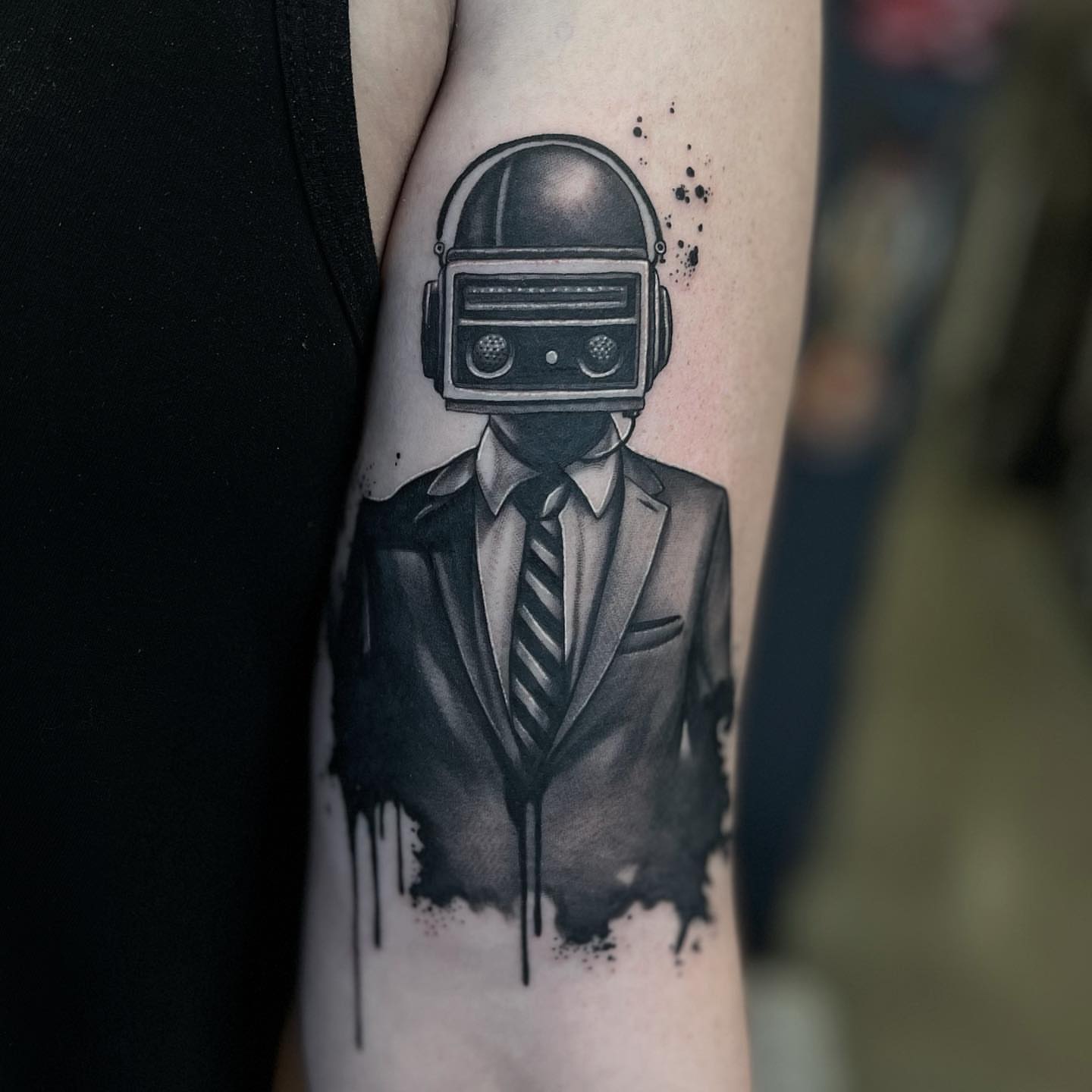 Robotic suit dotwork tattoo on the forearm by Jake Fujimura