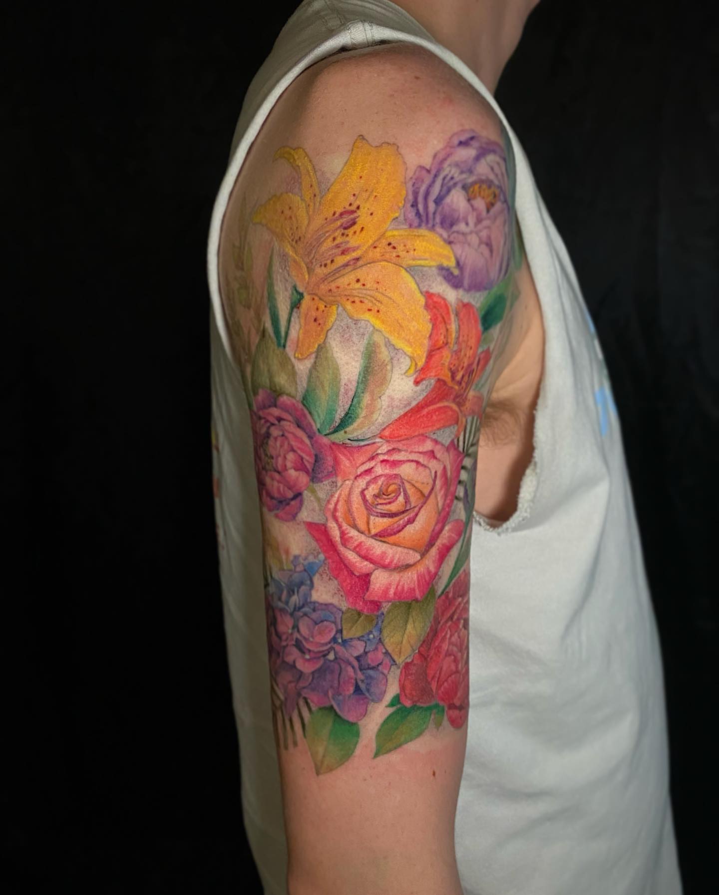 Floral bouquet realism tattoo on the upper arm by D Benzo ~ San Diego Tattoo artist ~