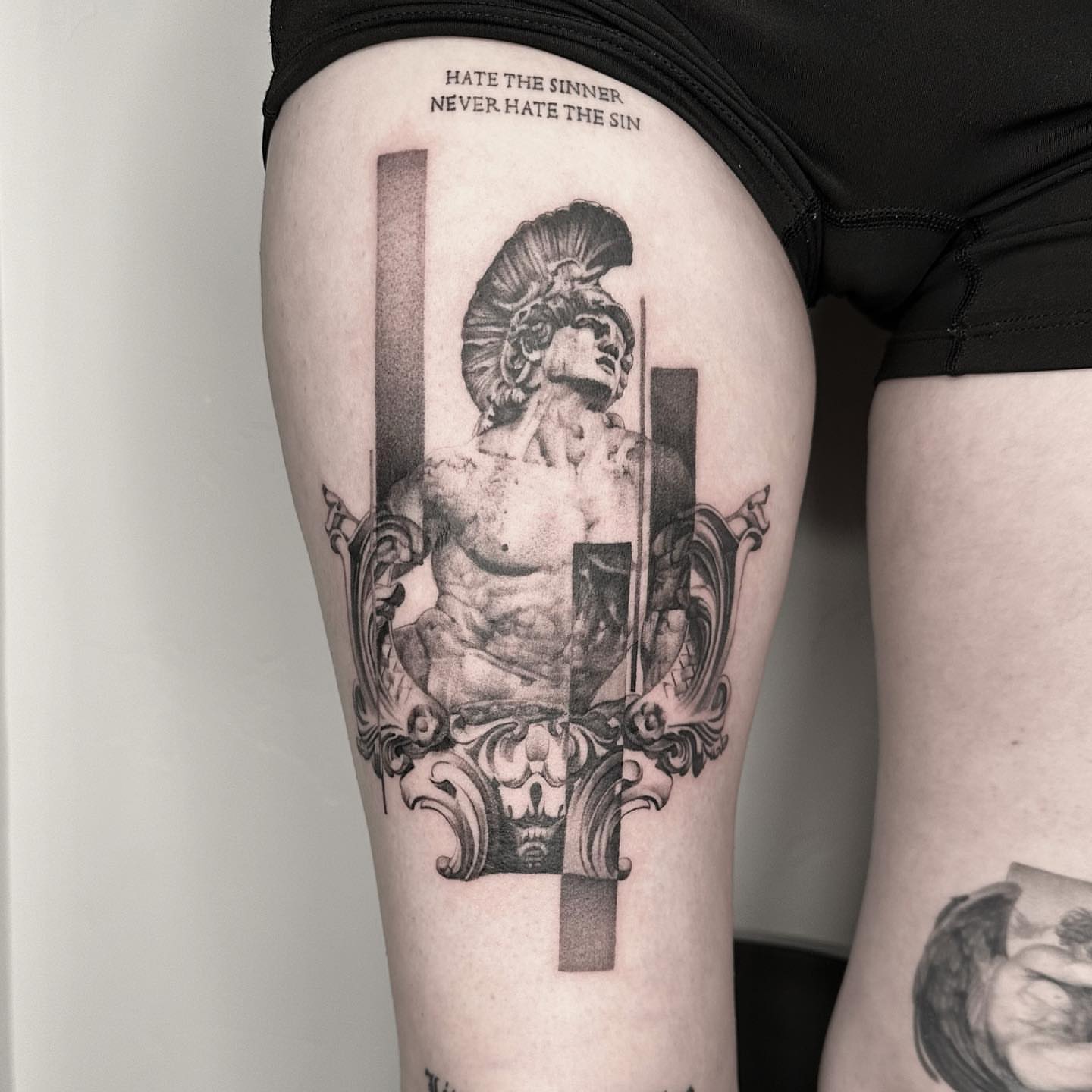 Statue of a warrior realism tattoo on the thigh by Paige Jean