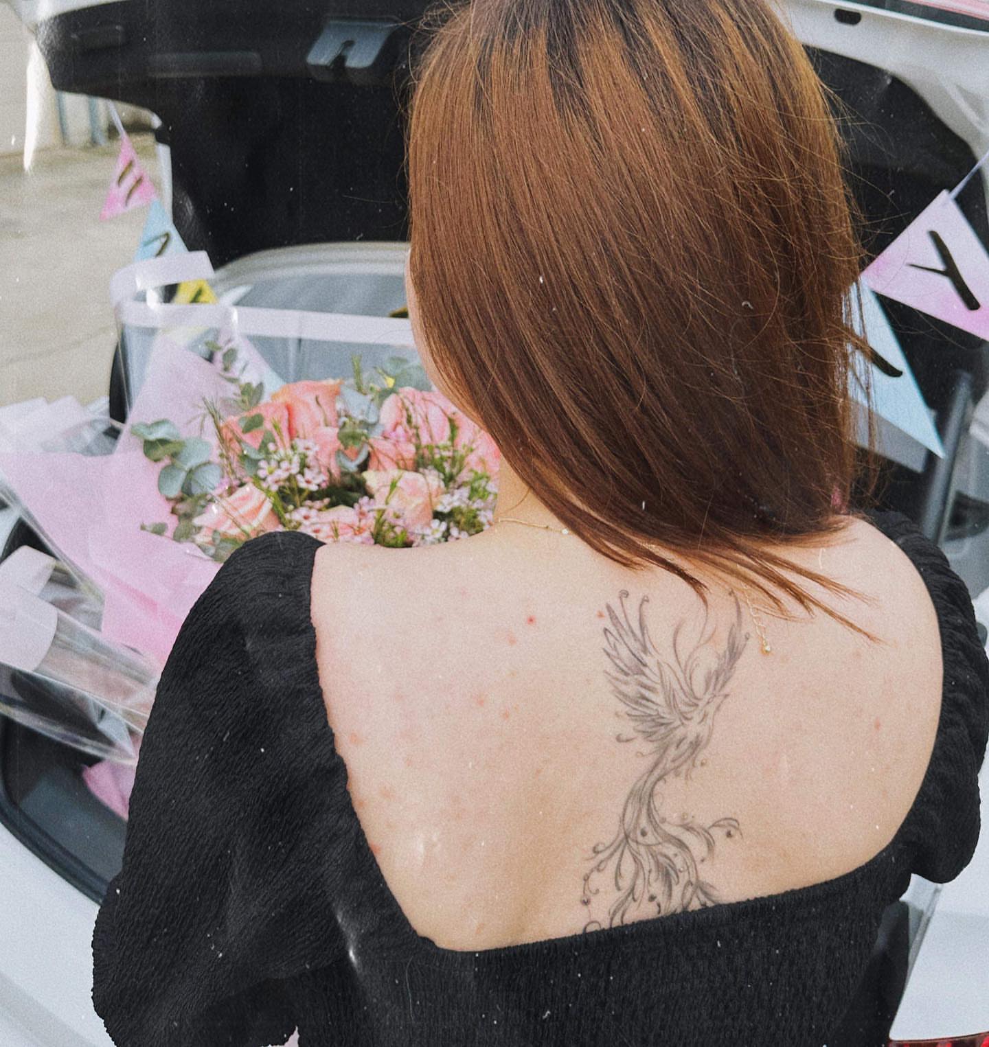 Phoenix black and grey tattoo on the back by Banky
