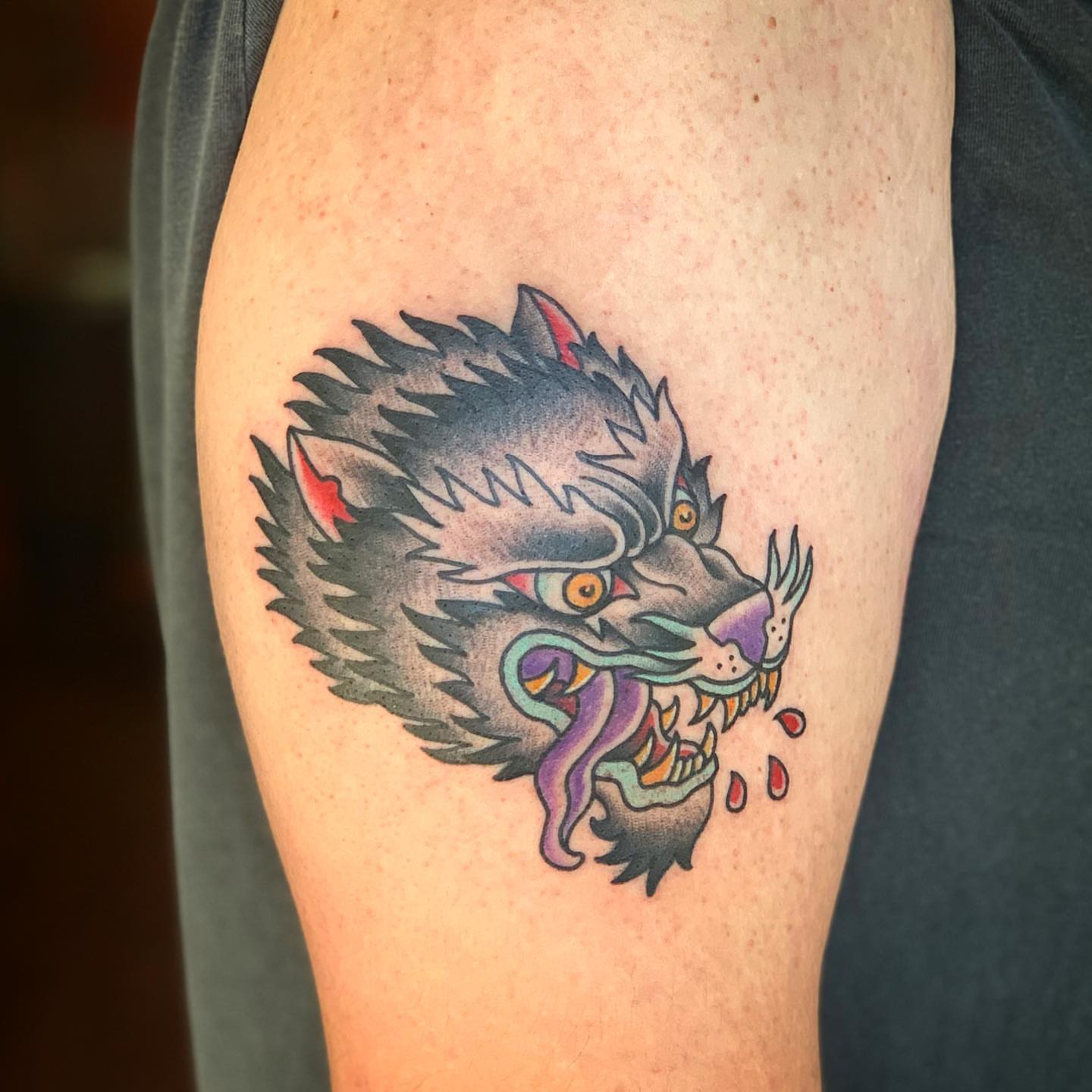 Wolf American traditional tattoo on the thigh by Brad Sterling