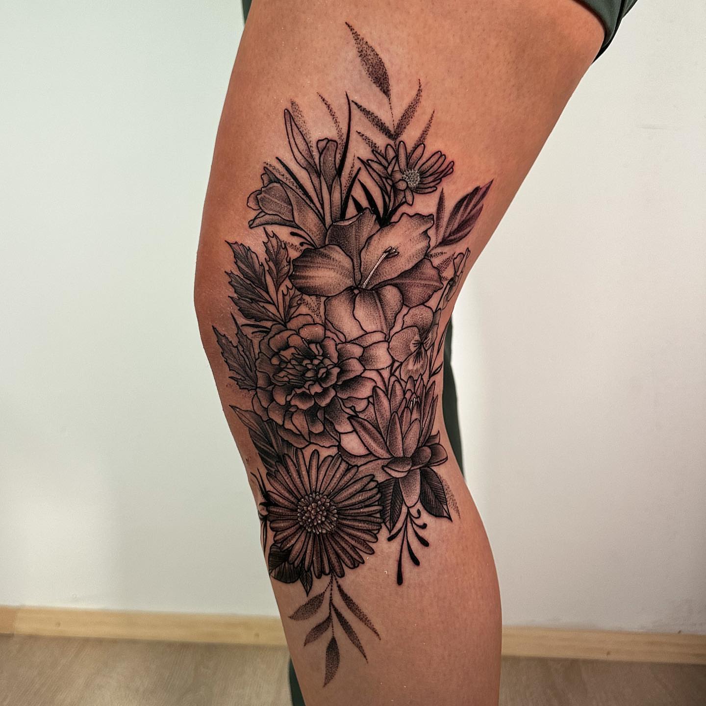 Floral bouquet black and grey tattoo on the thigh by all gas no brakes! no days off!