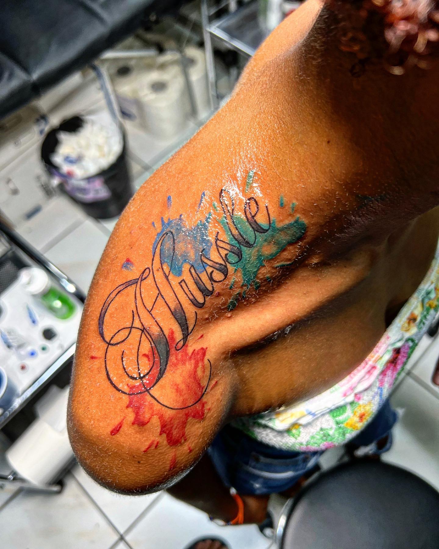 Script lettering lettering script tattoo on the upper arm by oxideTattoo, Morne-à-l'Eau