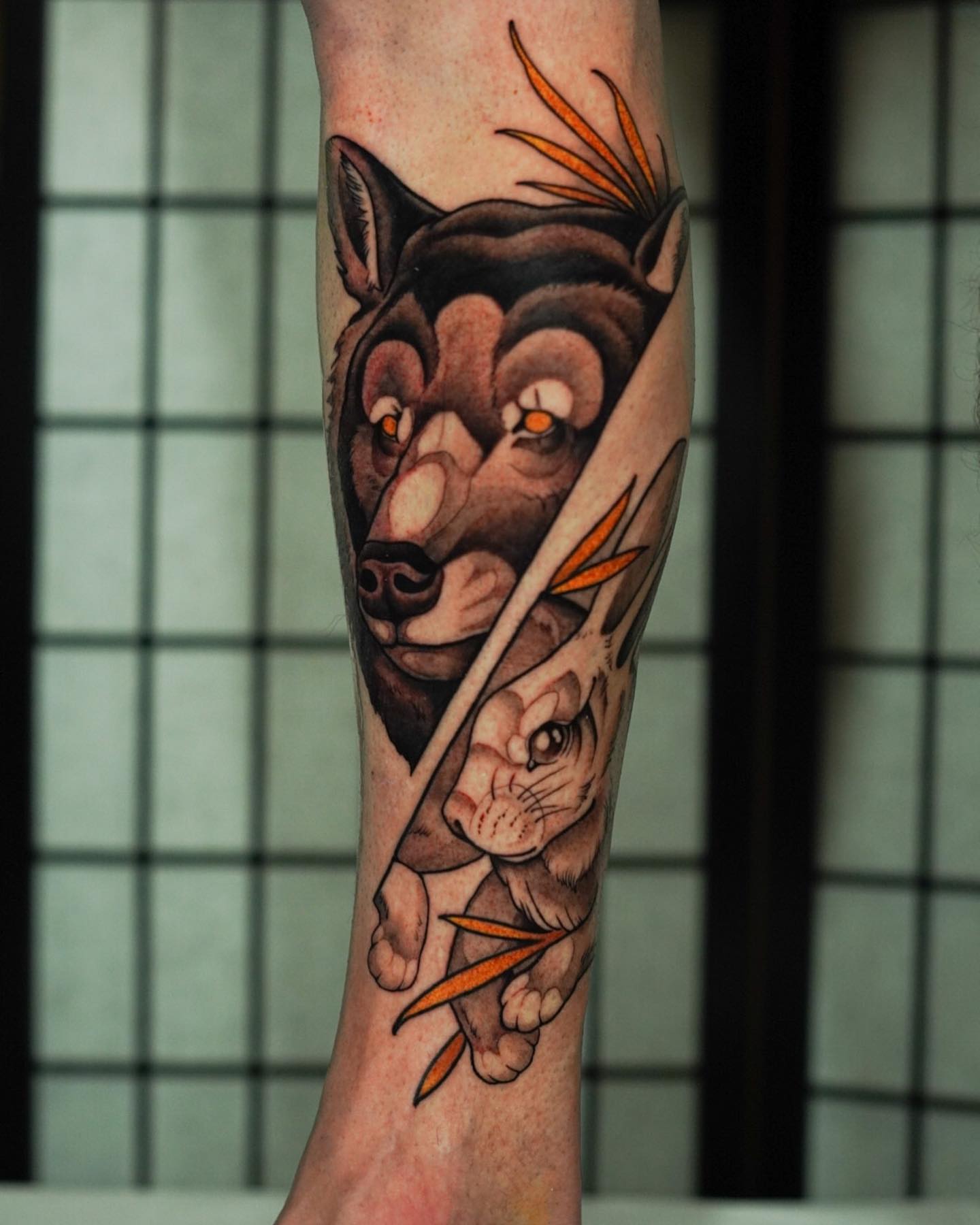 Wolf and rabbit realism tattoo on the forearm by Neo-Traditional tattoos in Las Vegas