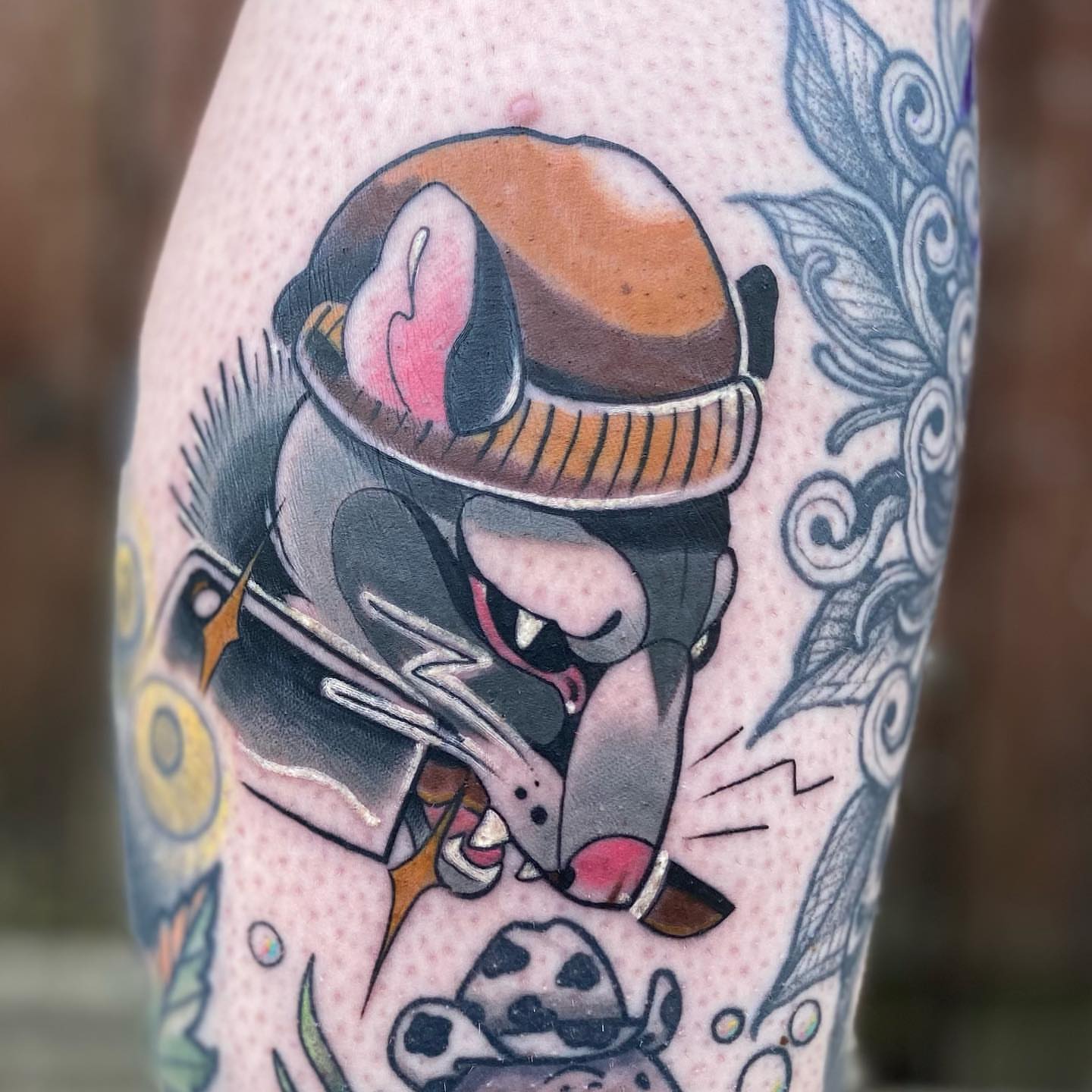 Cat wearing helmet dotwork tattoo on the forearm by Rat Girl, Dayton, Ohio
