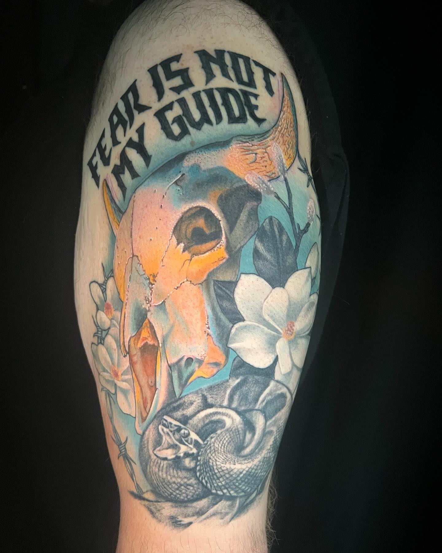 Skull and snake realism tattoo on the forearm by Mary Blake Tattoos, Franklin, Tennessee