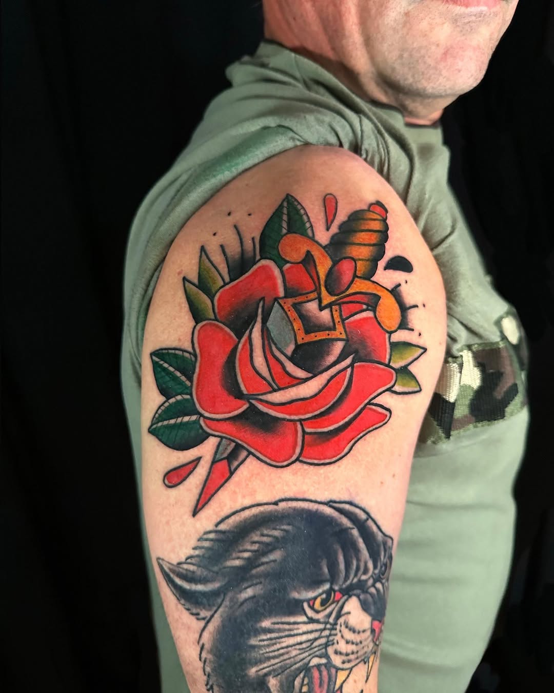 Rose and dagger neo-traditional tattoo on the upper arm by Dennis Alejandro
