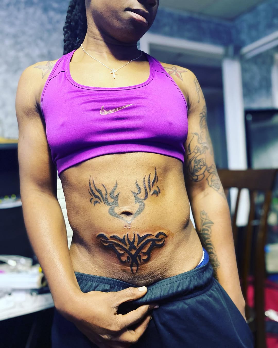 Tribal abstract design on stomach tattoo on the torso by Danimals