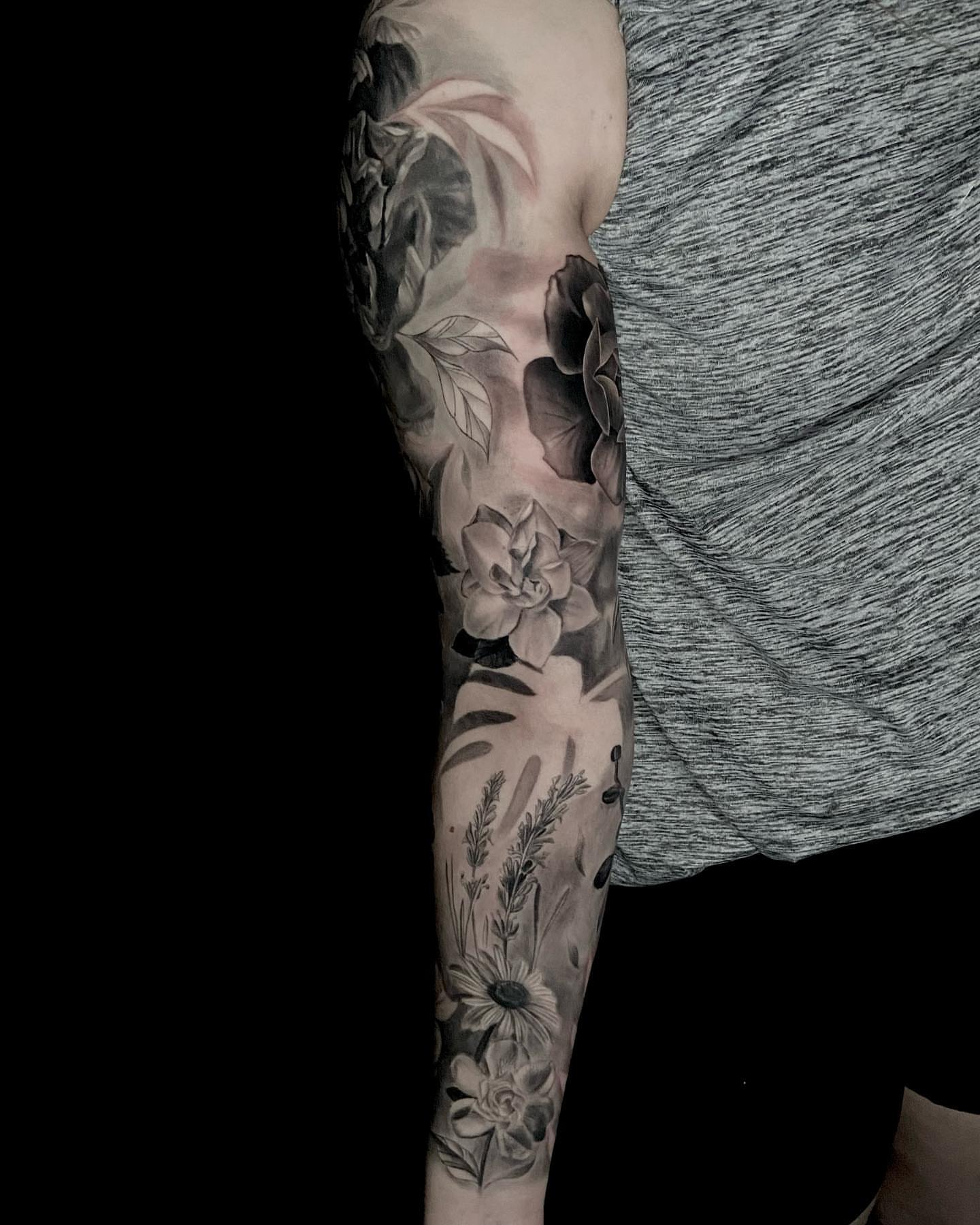 Floral arrangement black and grey tattoo on the forearm by Jules, Arlington, Texas