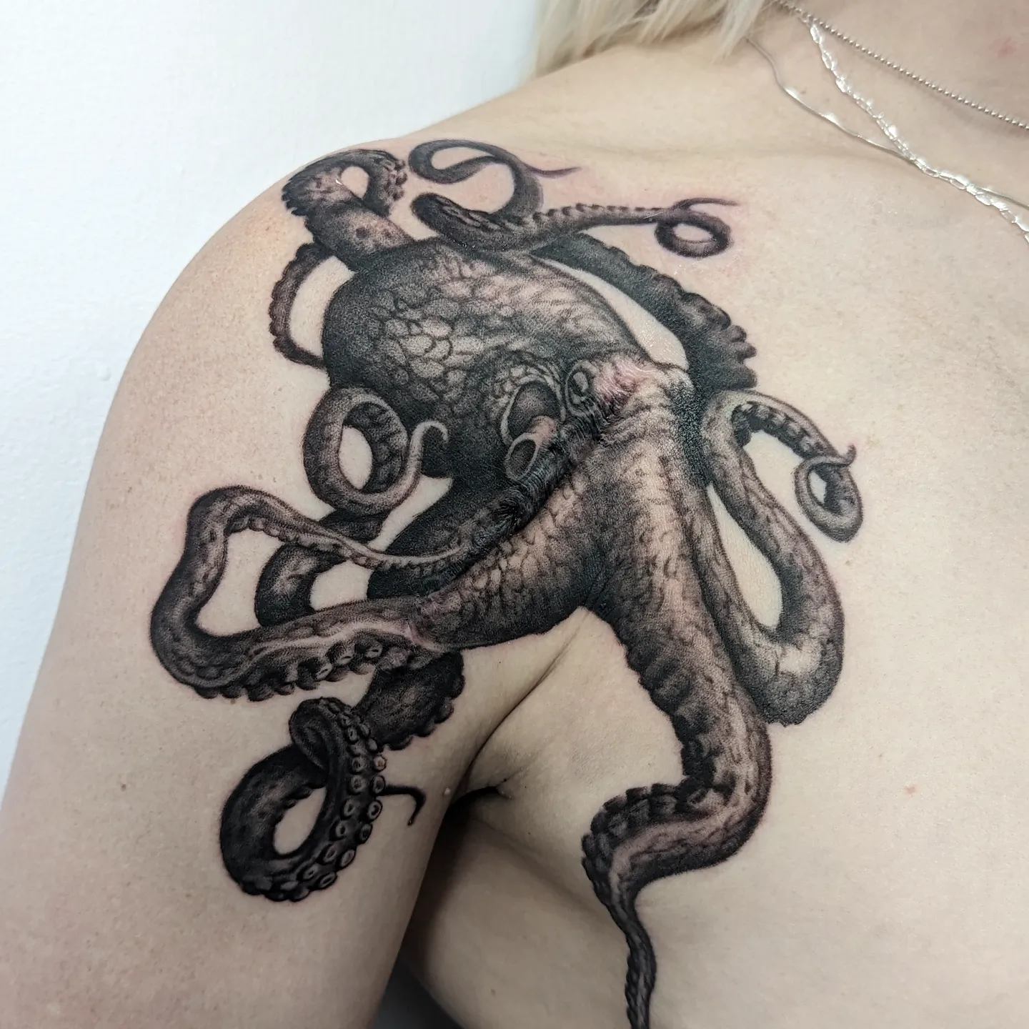 Octopus realism tattoo on the shoulder by Sean Costello