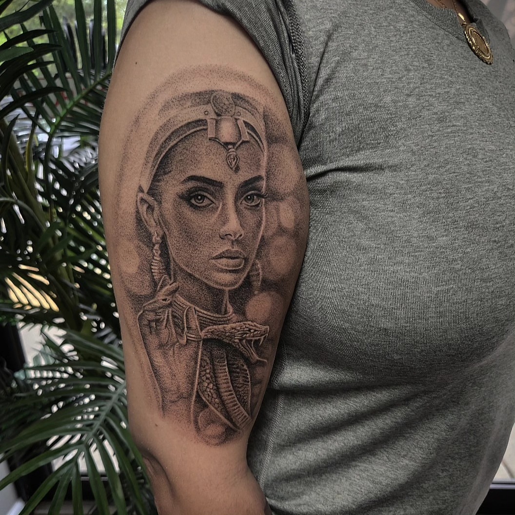 Woman with snake dotwork tattoo on the shoulder by Kyle Joseph [tattoo artist]