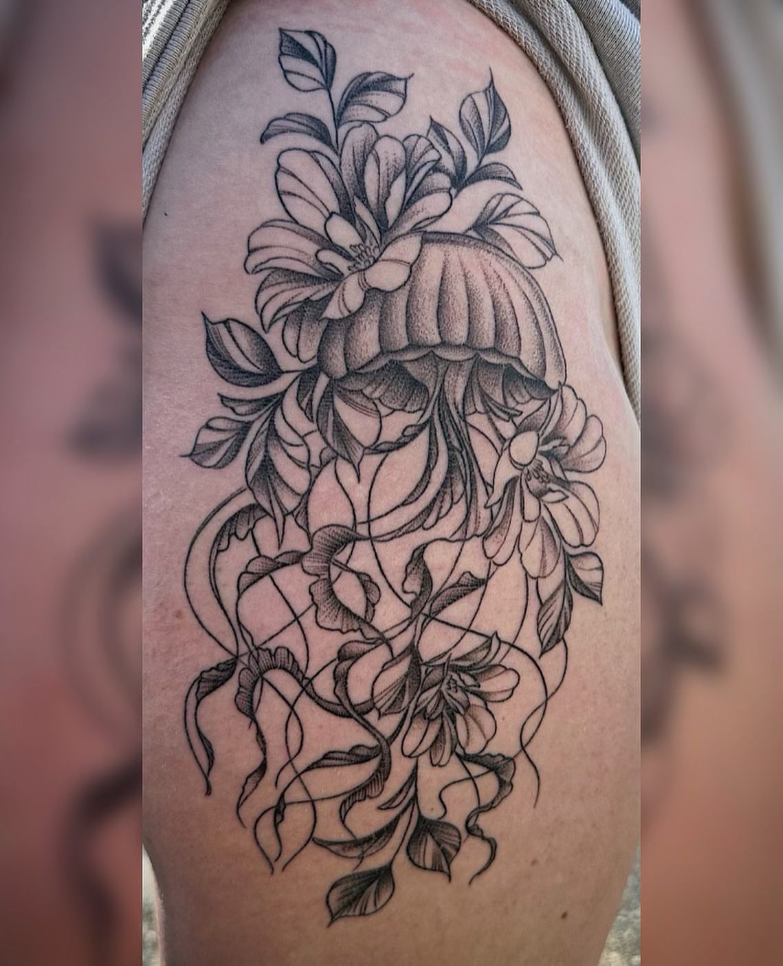 Jellyfish and flowers realism tattoo on the thigh by Christopher Heffley