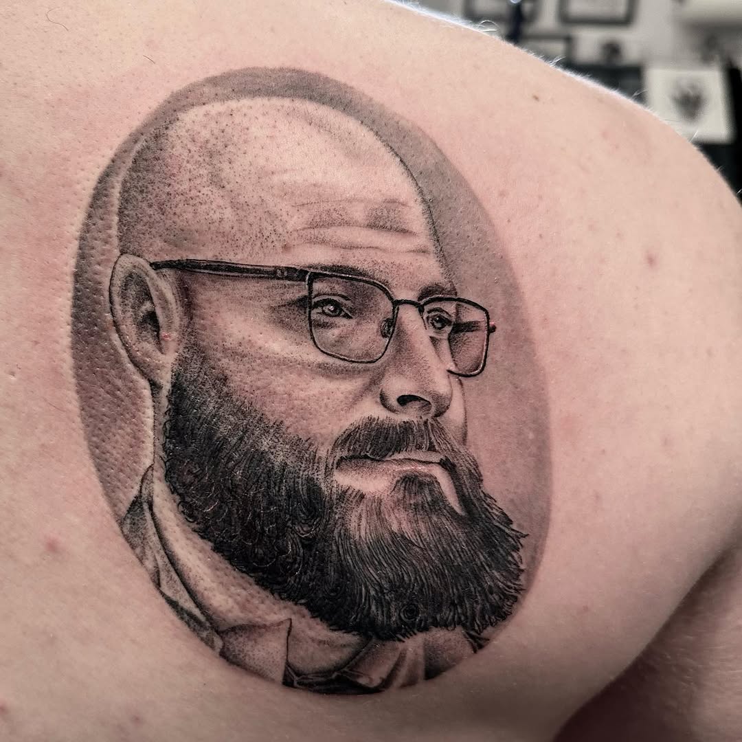 Surrealism tattoo on the shoulder by Matthew Clanin