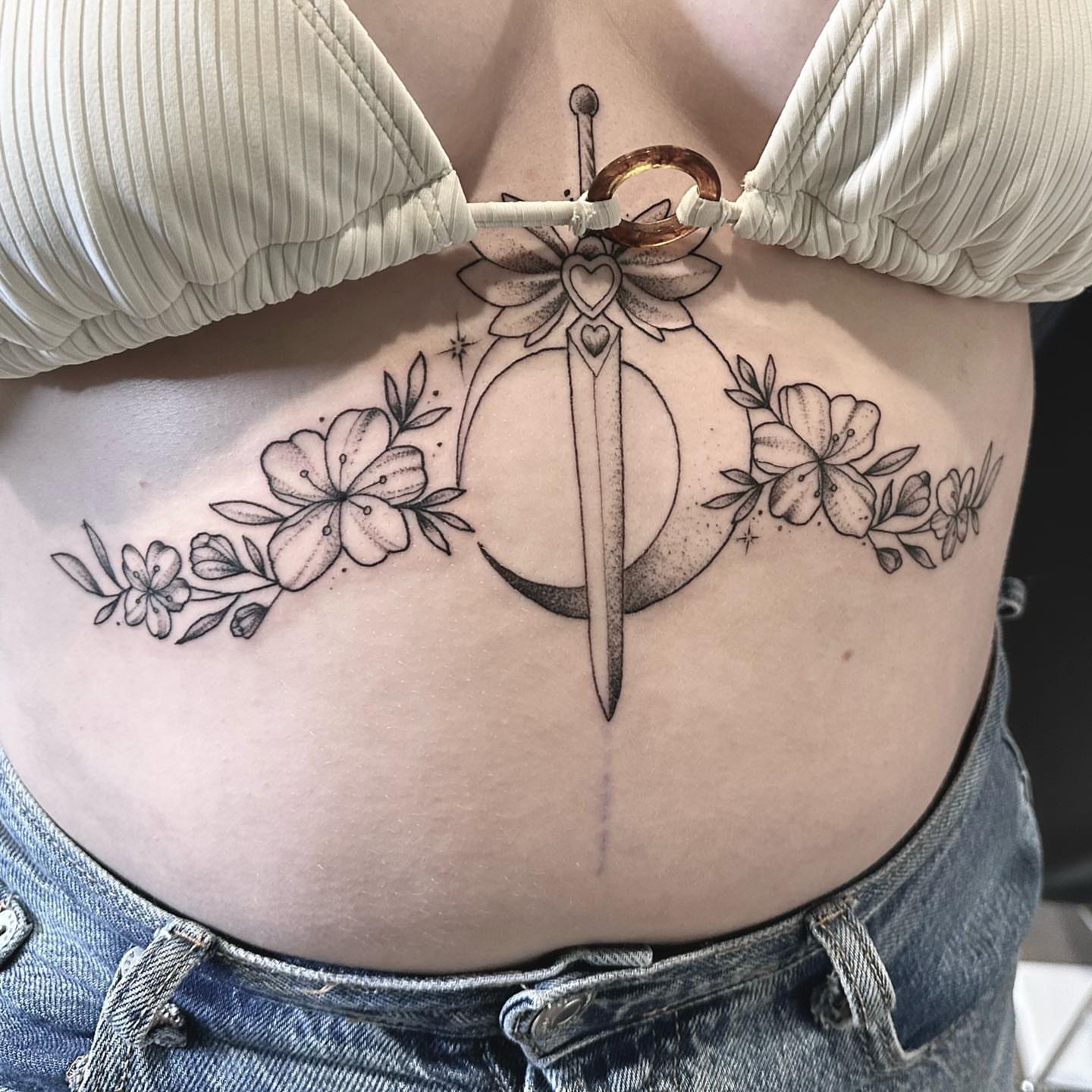 Sword and crescent moon black and grey tattoo on the ribs by Matthew Clanin