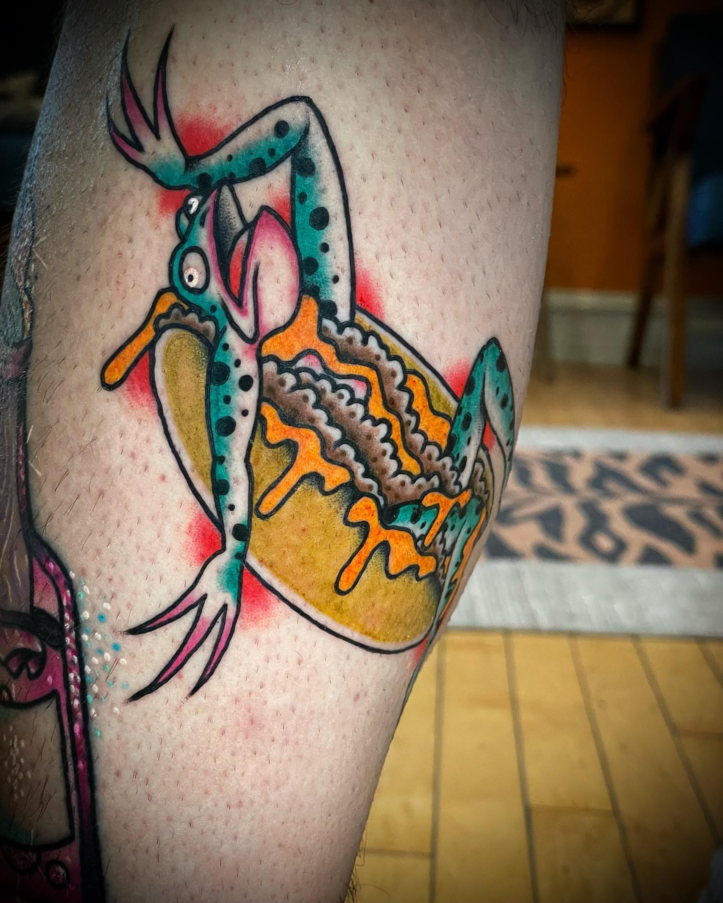 Frog American traditional tattoo on the thigh by Alex Muniz