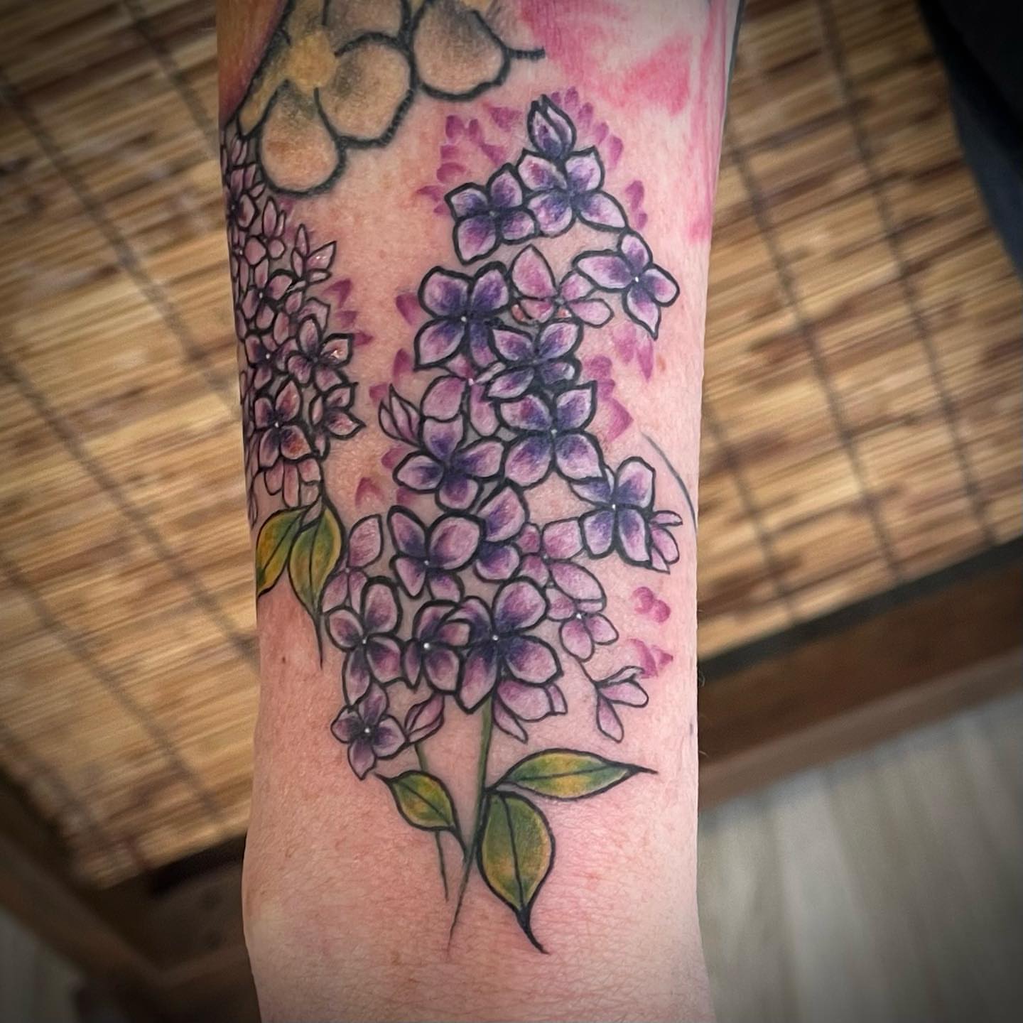 Lilac flowers watercolor tattoo on the forearm by Brianna, Portland, Oregon