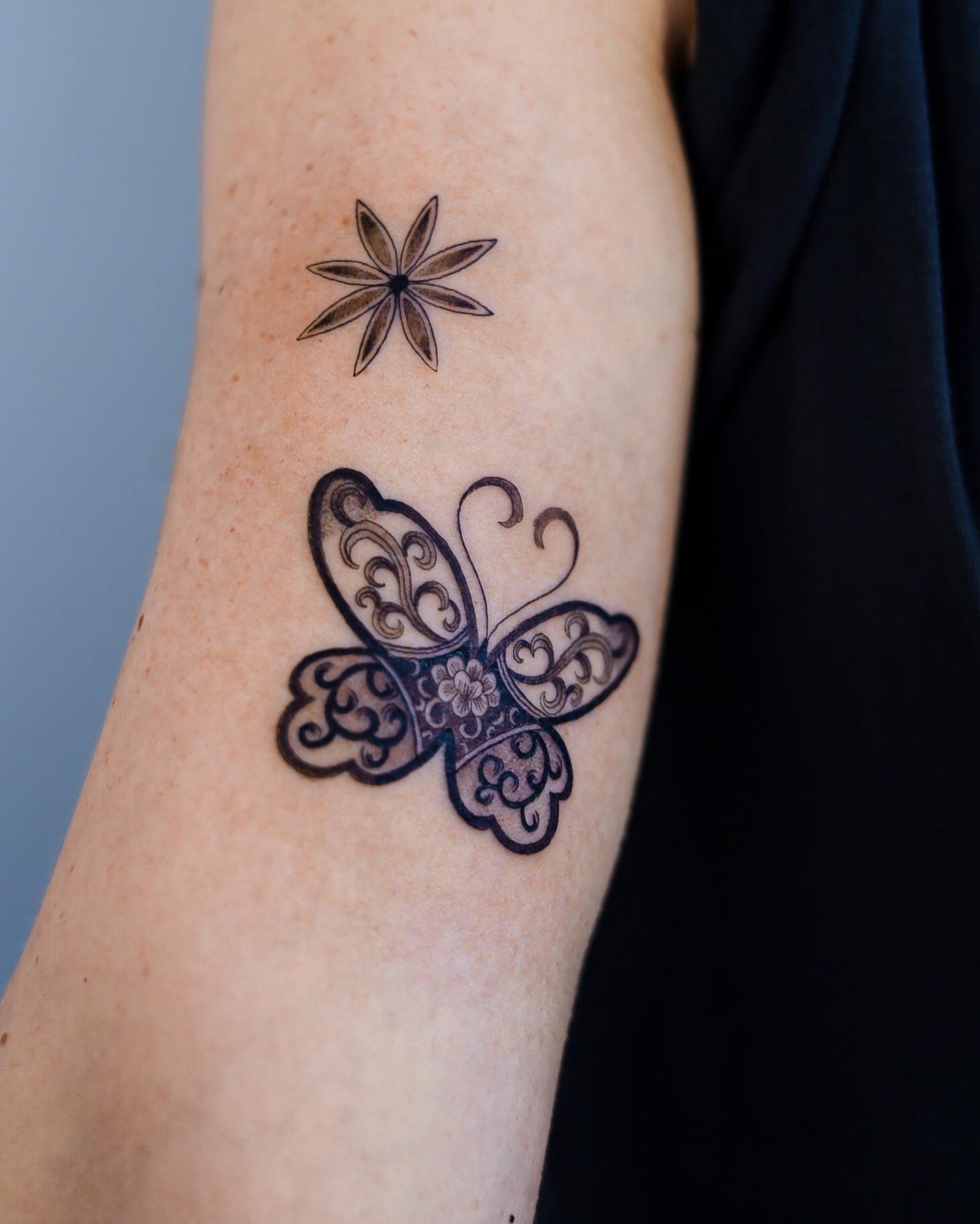 Butterfly ornamental tattoo on the forearm by Swani