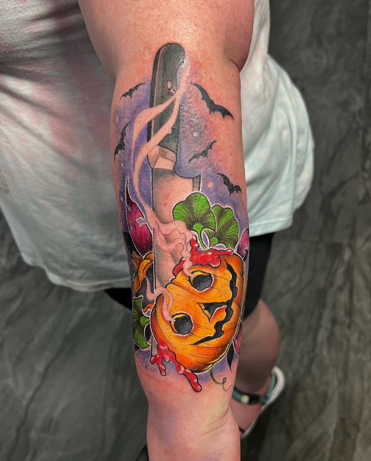 Pumpkin and knife watercolor tattoo on the forearm by ✨ 𝖘𝖙𝖆𝖇 𝖘𝖙𝖆𝖇 𝖘𝖙𝖆𝖇 ✨
