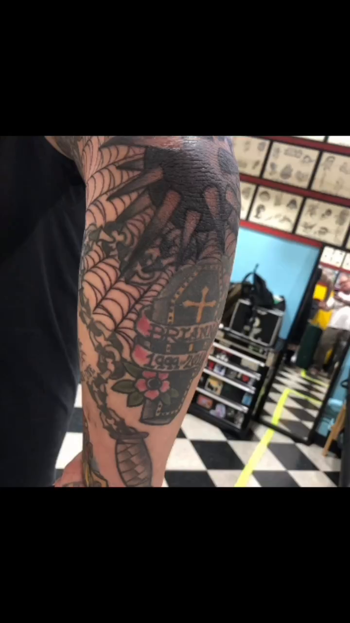 Skull and spiderweb American traditional tattoo by Edward Choat