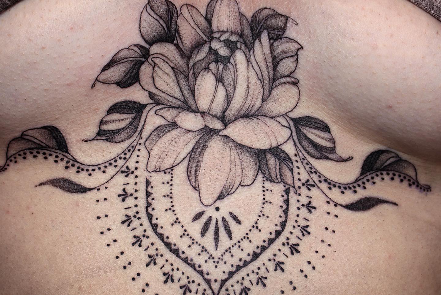 Lotus flower dotwork tattoo on the shoulder by Aim 🤍