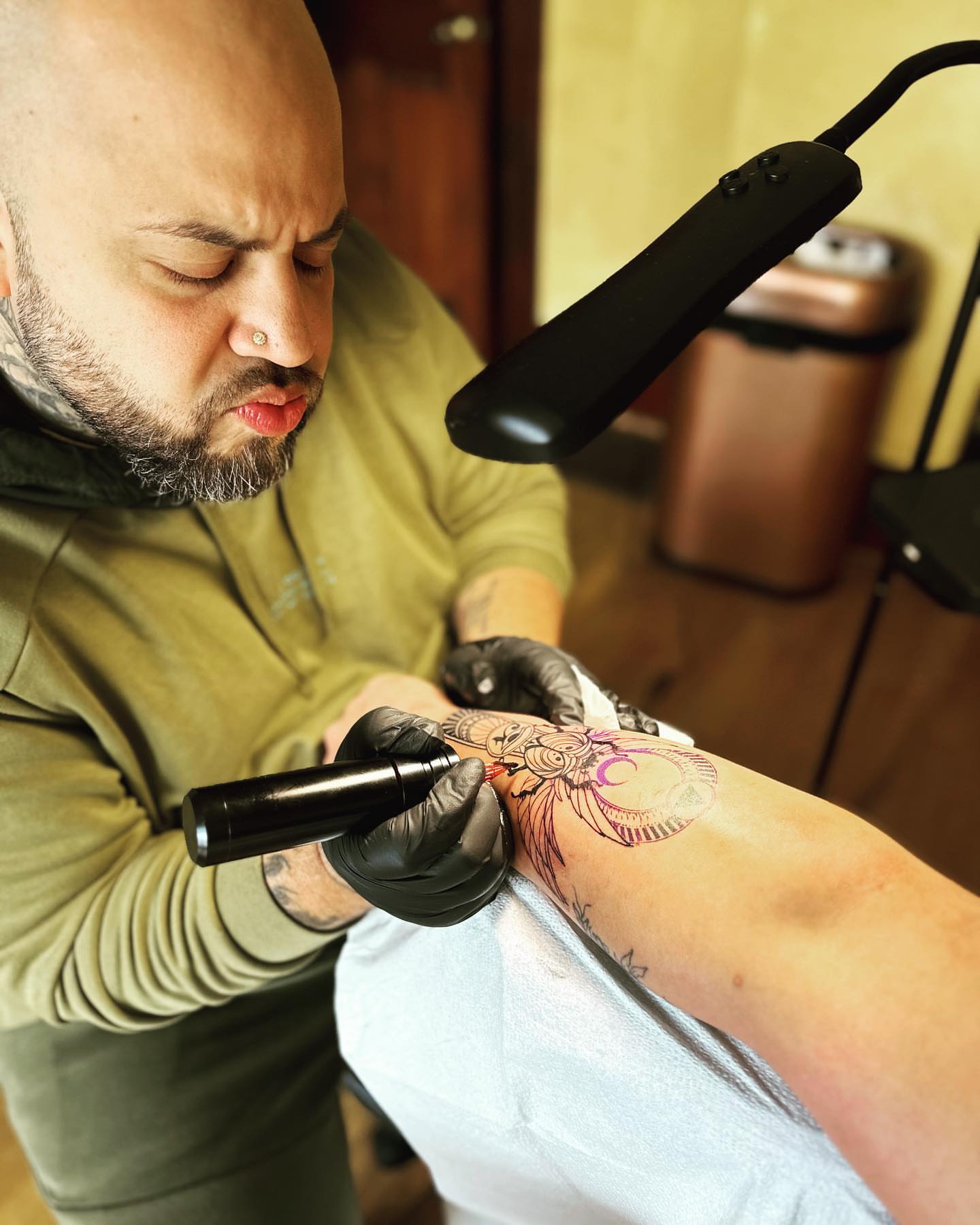 Mask American traditional tattoo on the forearm by Shamanic Ink