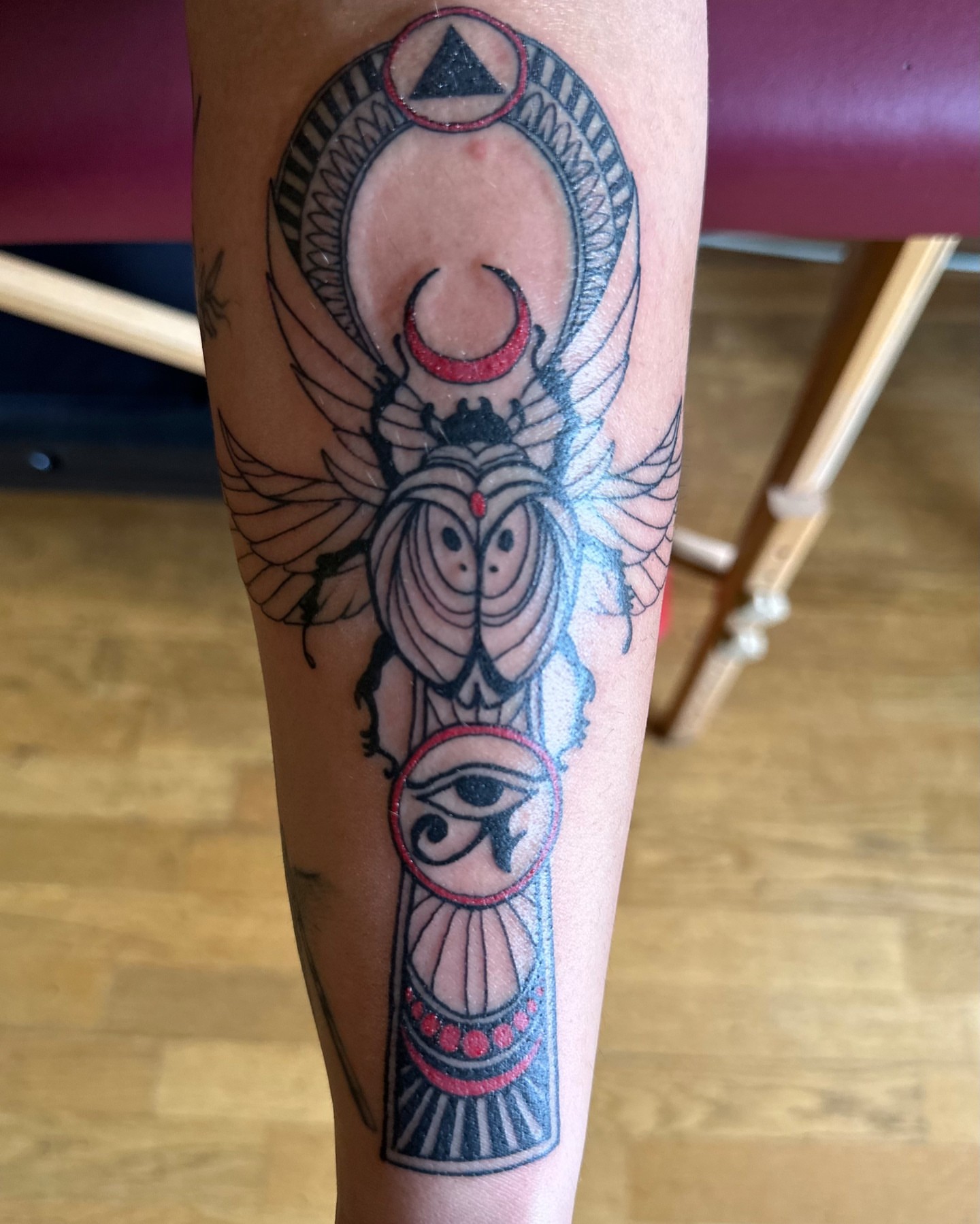 Scarab beetle and eye of horus American traditional tattoo on the forearm by Shamanic Ink