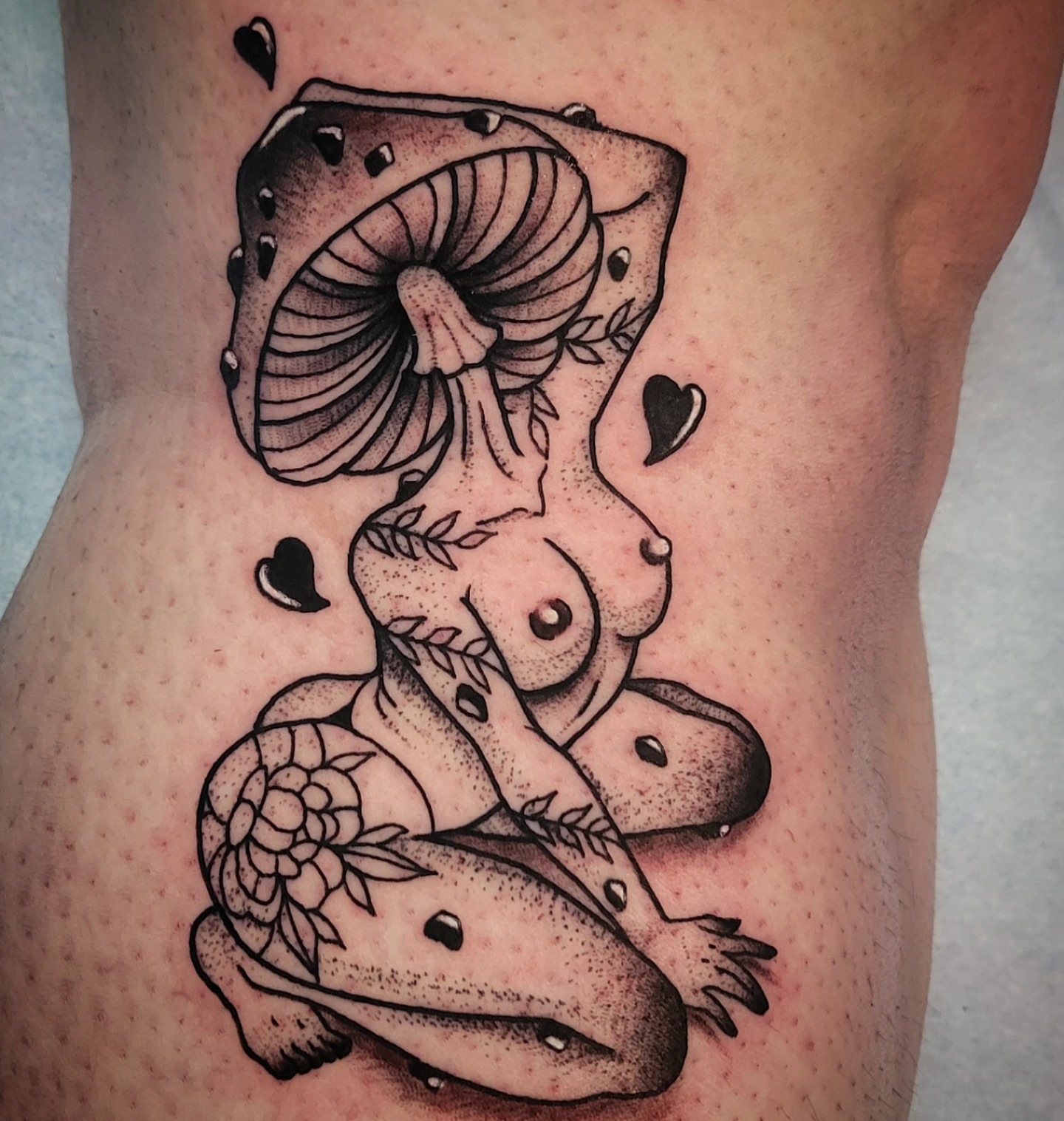 Mushroom and nude figure dotwork tattoo on the thigh by @lovelornpotato
