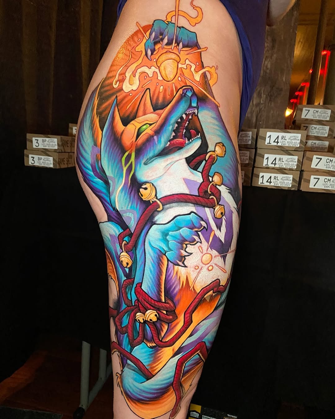 Stylized fox with bells new school tattoo on the thigh by Jon Ronzka