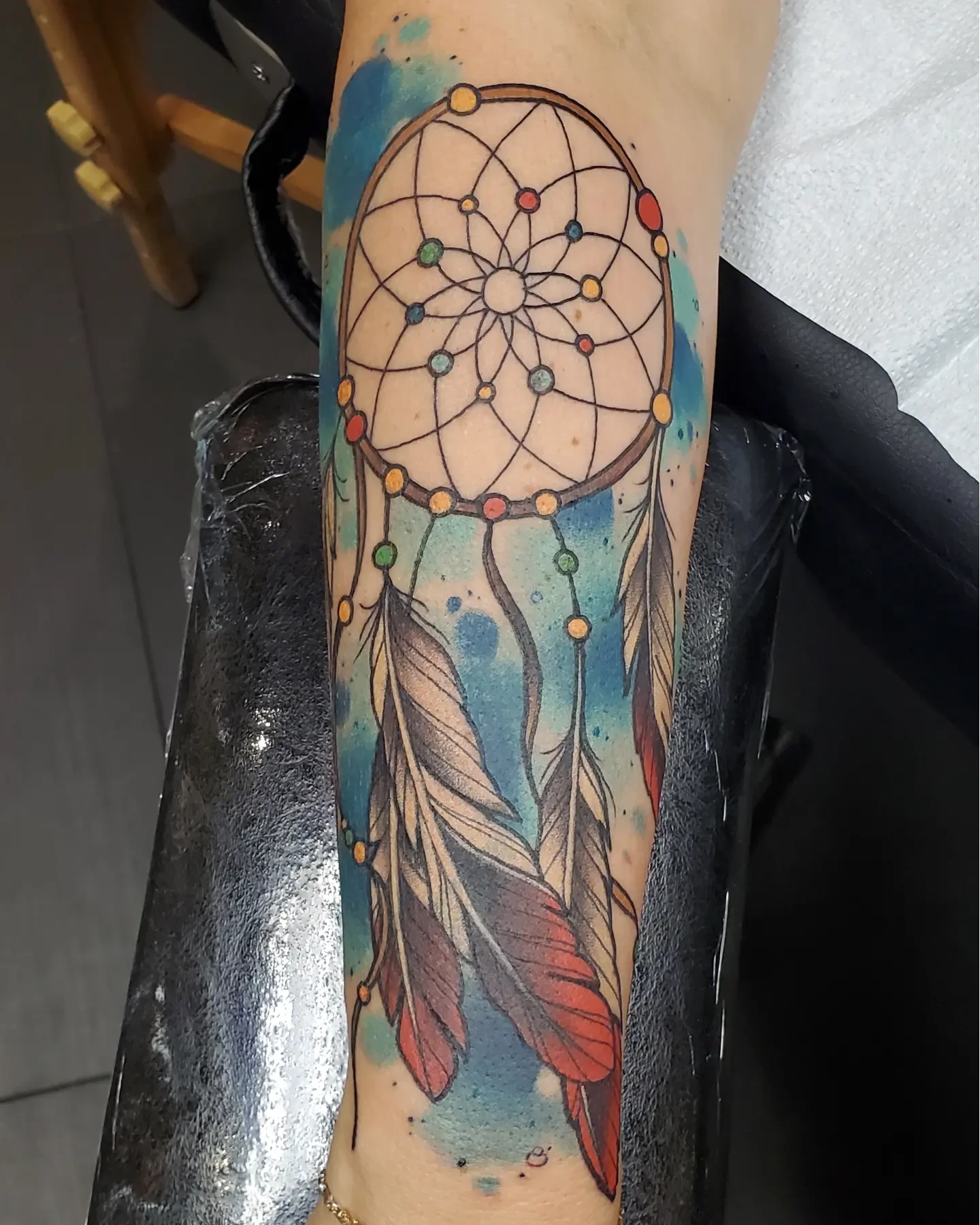 Dreamcatcher watercolor tattoo on the forearm by Brian Savage, Gilbert, Arizona