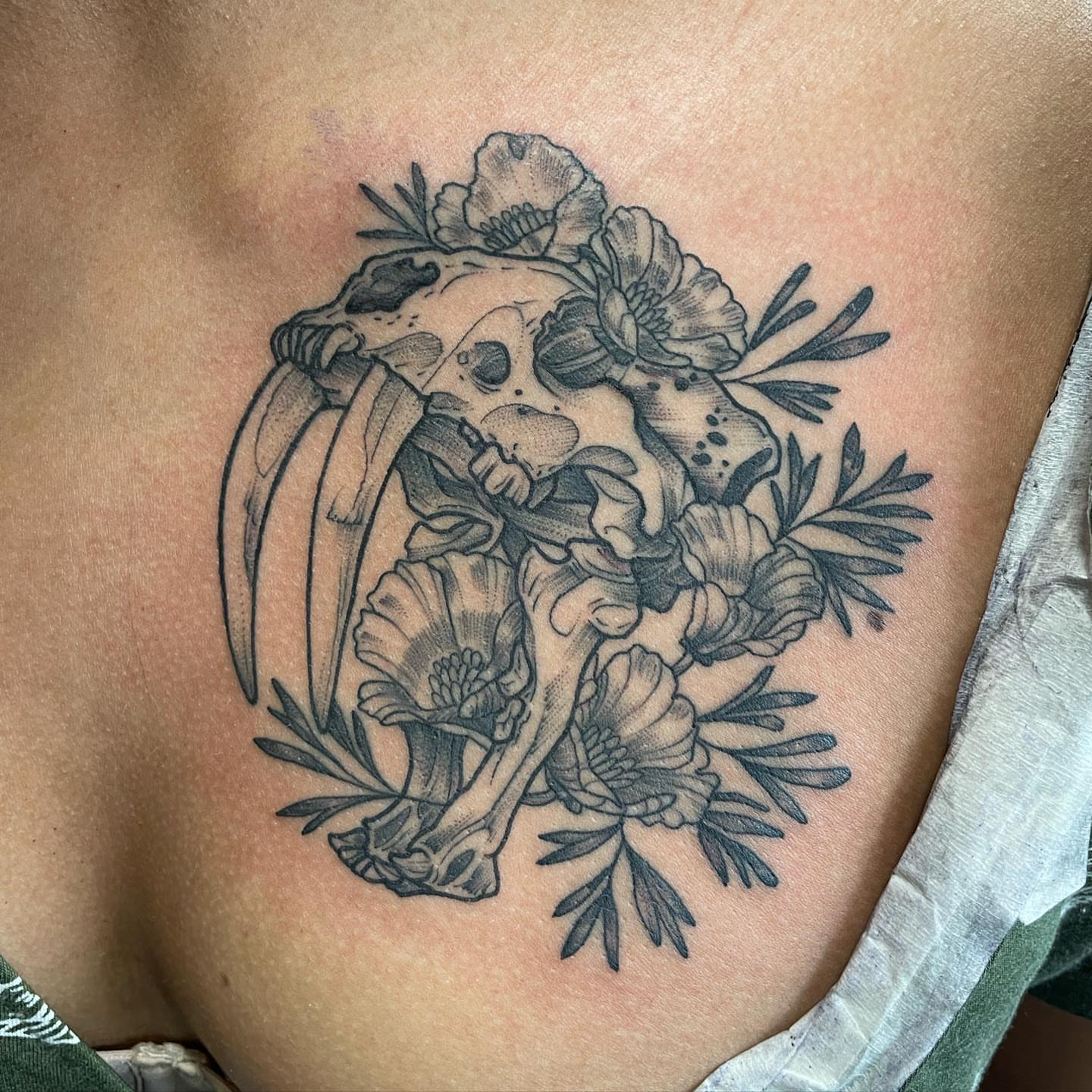 Skull and scythe black and grey tattoo on the chest by Kirsten Marsden Ballantyne