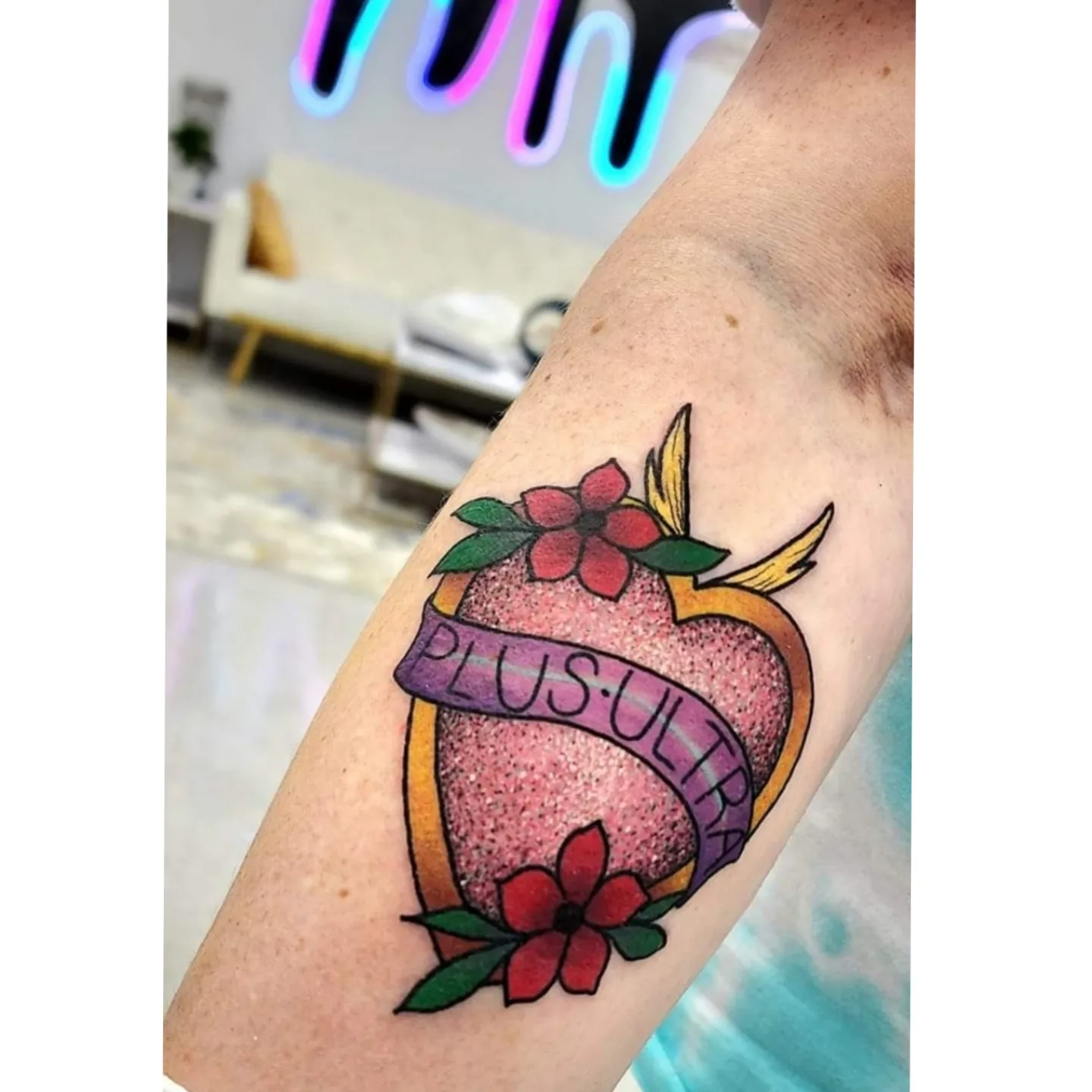 Heart with 'PLUS ULTRA' American traditional tattoo on the forearm by Diane Maya