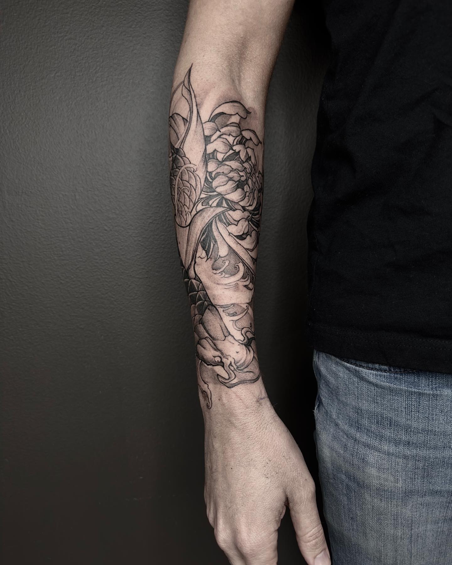 Snake and peony realism tattoo on the forearm by Shihao zhao