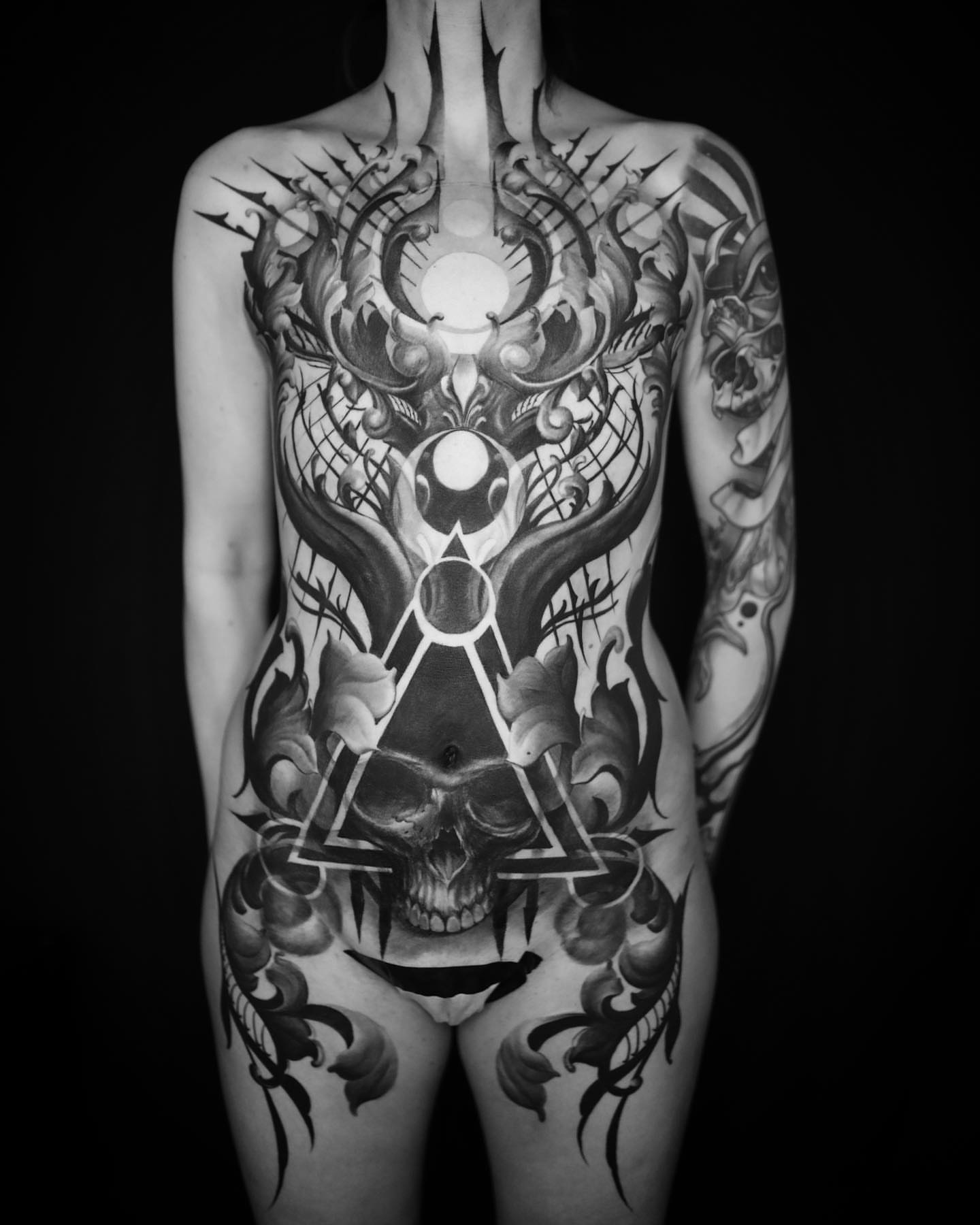 Geometric skull geometric tattoo on the torso by ➕d U S T I N C H A R L e S➕, Seattle, Washington