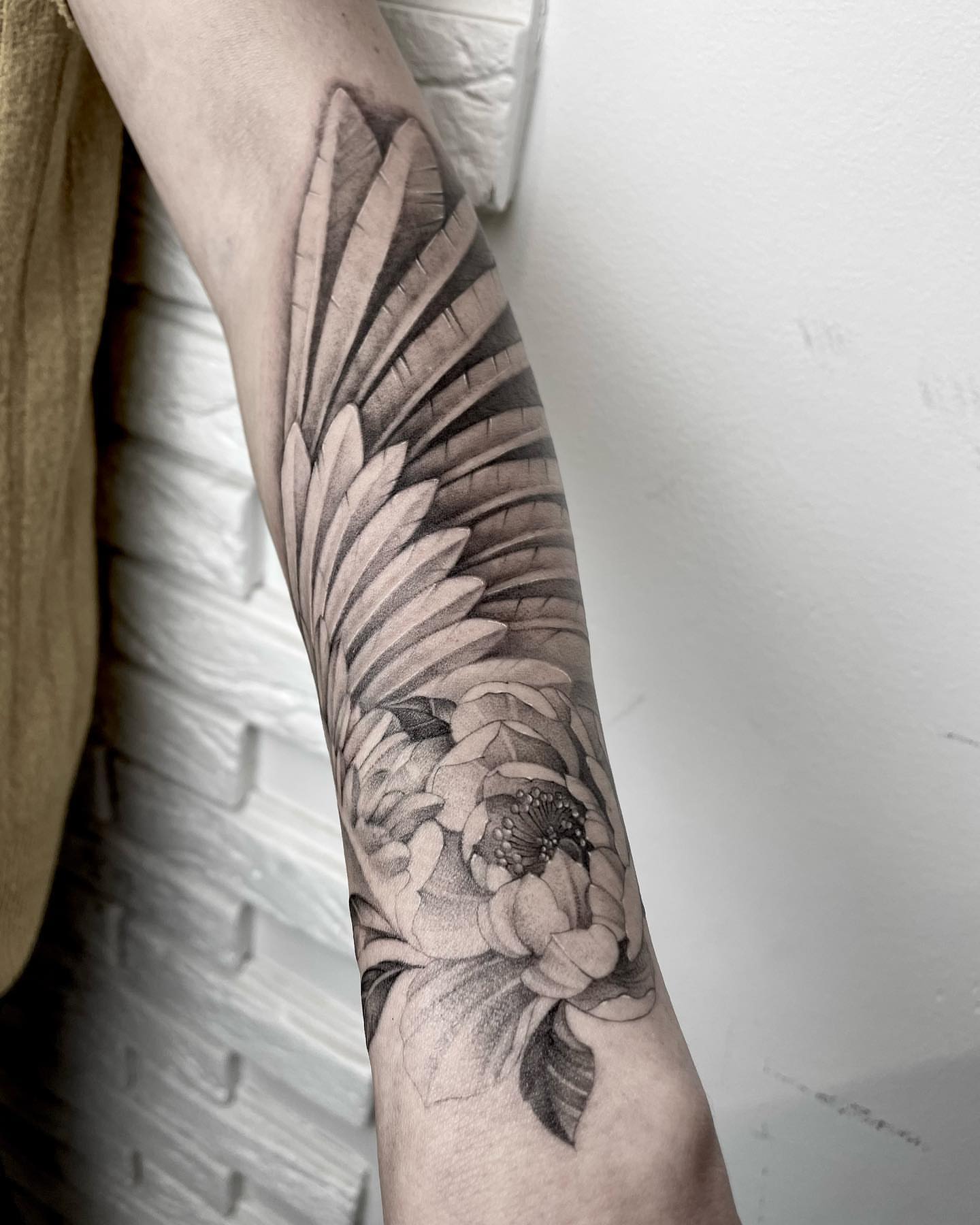 Floral design realism tattoo on the forearm by Annie Overchuk