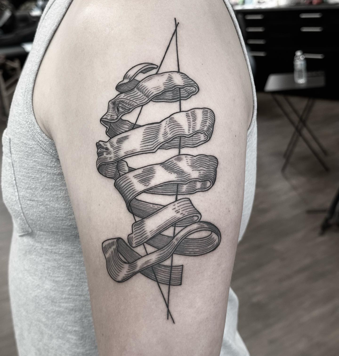 Ribbons black and grey tattoo on the forearm by Kirsten Marsden Ballantyne