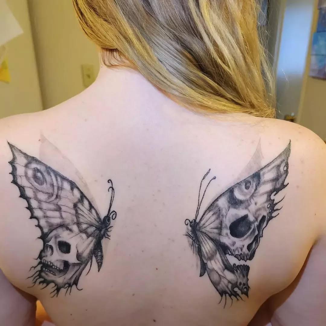 Skull butterflies fine line tattoo on the back by Russell Lucas