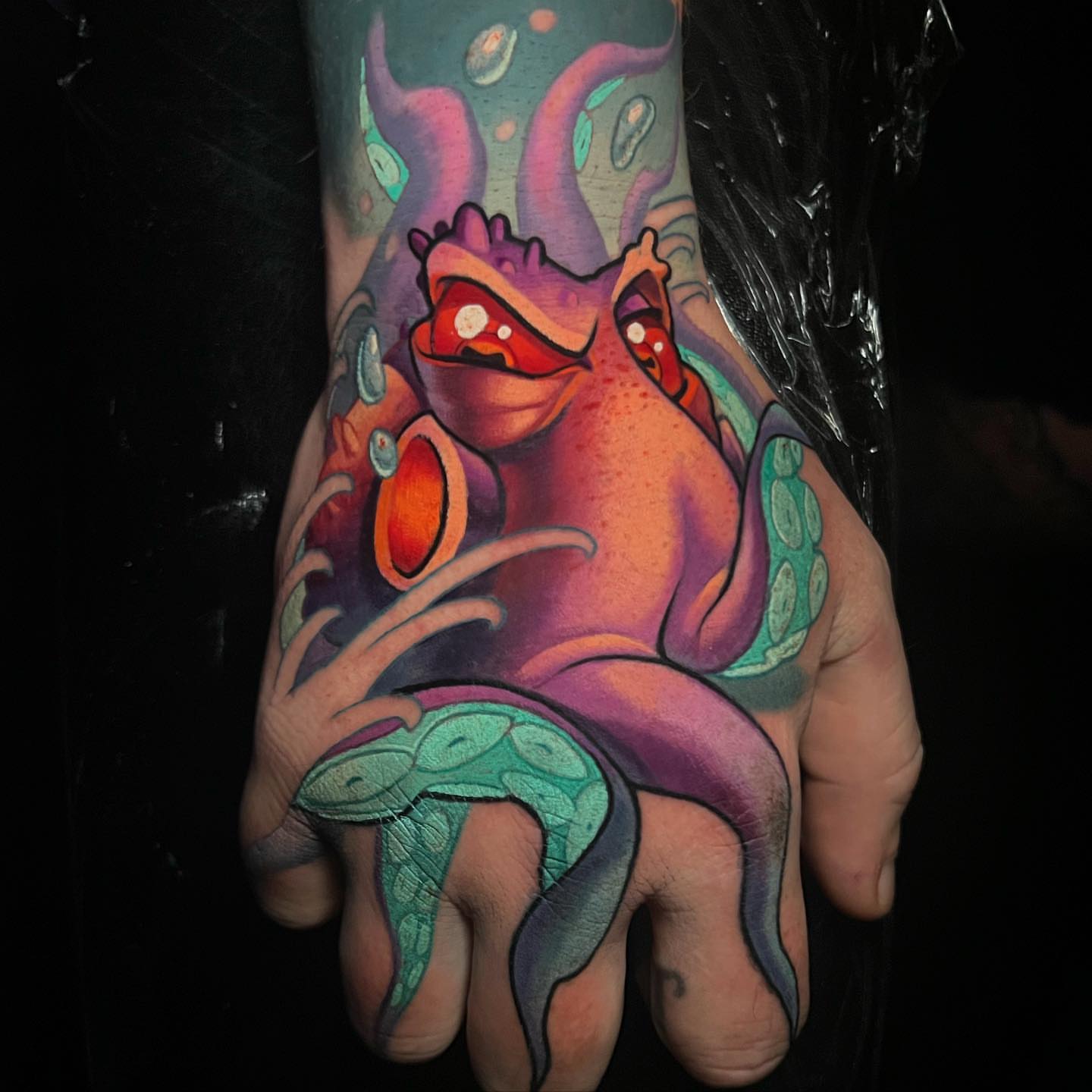 Octopus new school tattoo on the hand by Tim Stafford