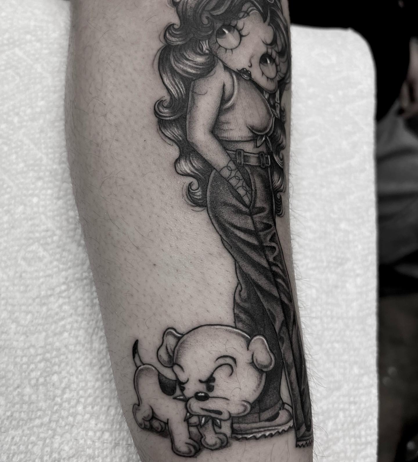 Woman and dog realism tattoo on the forearm by Valerie Dominguez