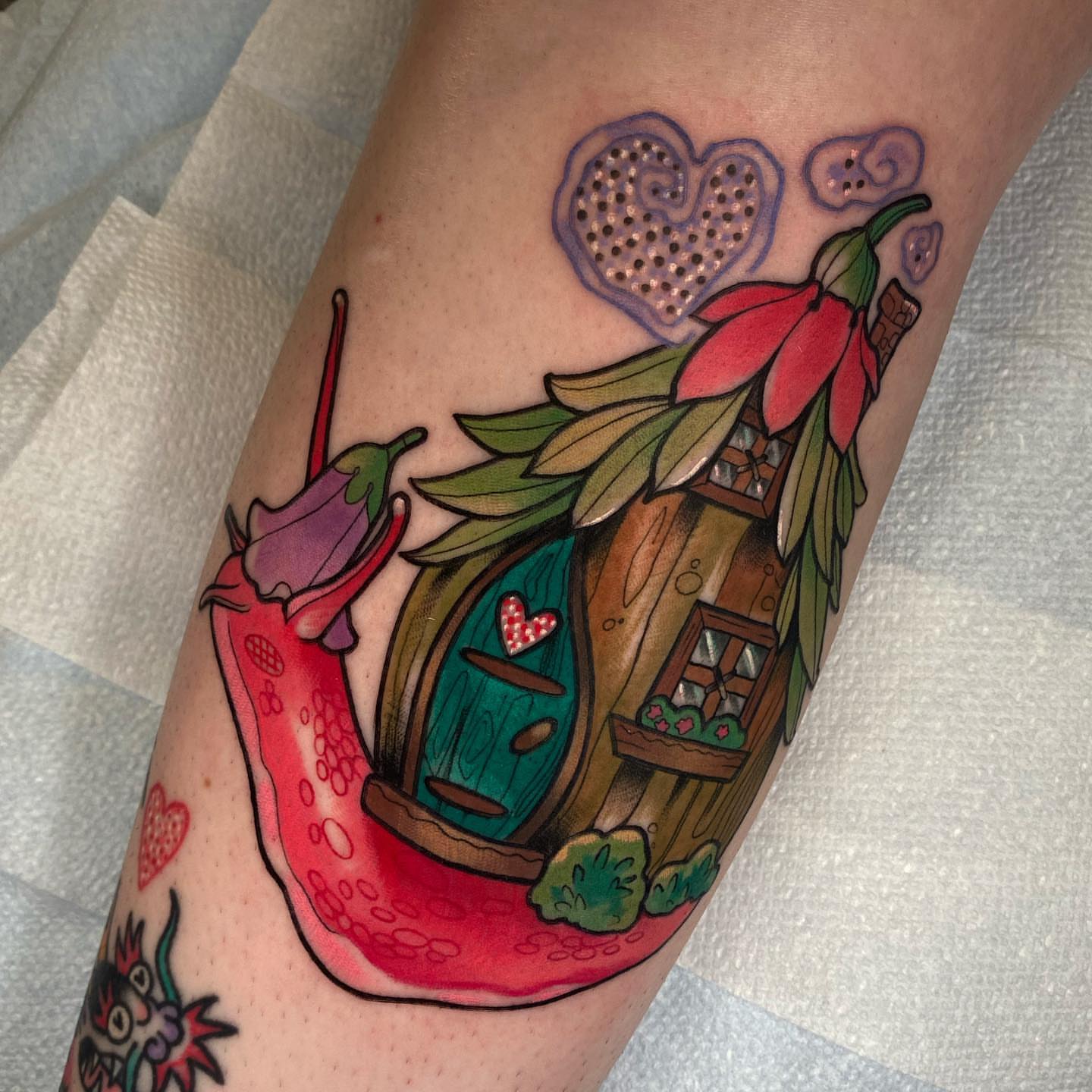 Elf house and chili peppers American traditional tattoo on the forearm by Kara Klenk