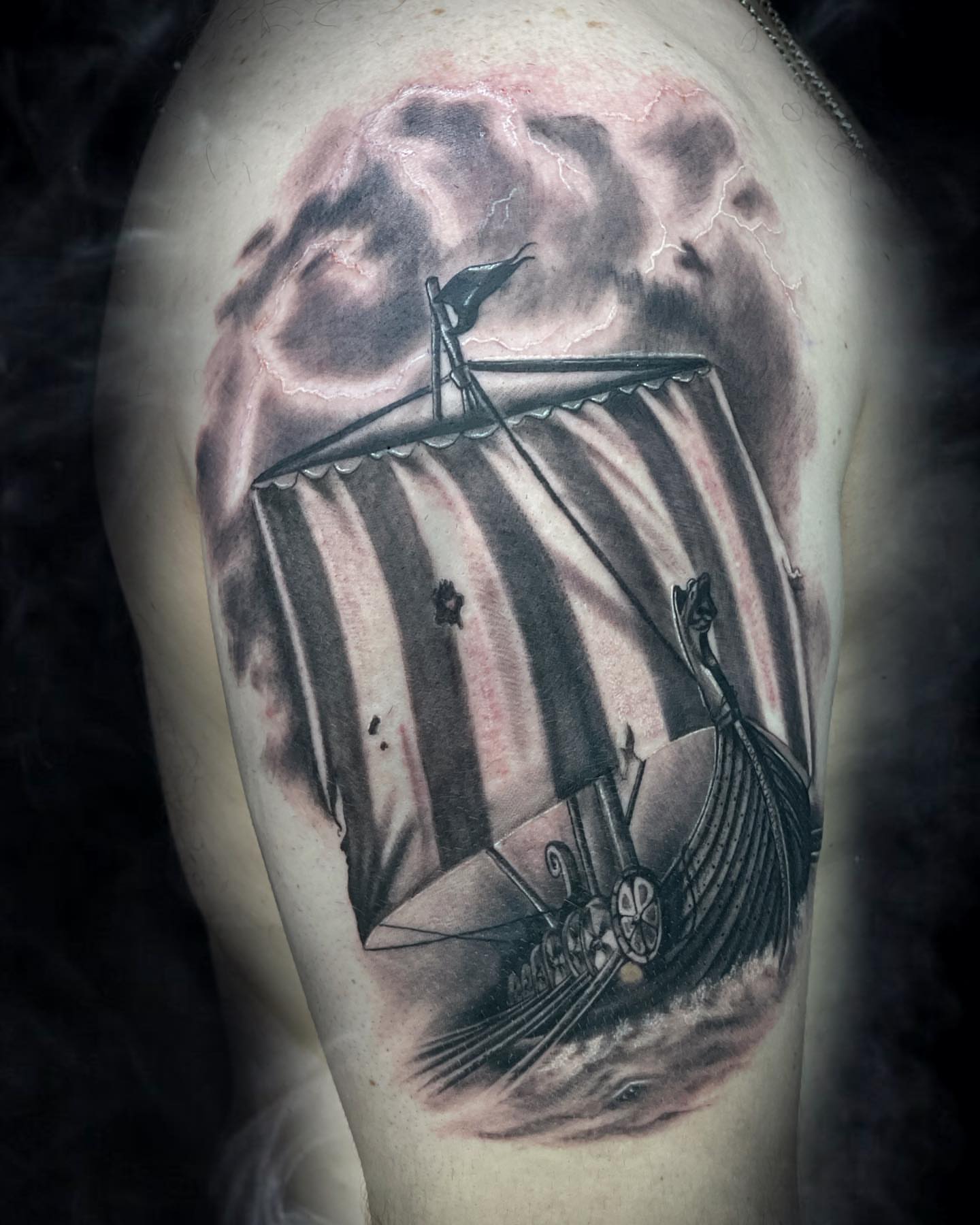 Ship sailing storm realism tattoo on the thigh by Ksu Storm, San Francisco, California