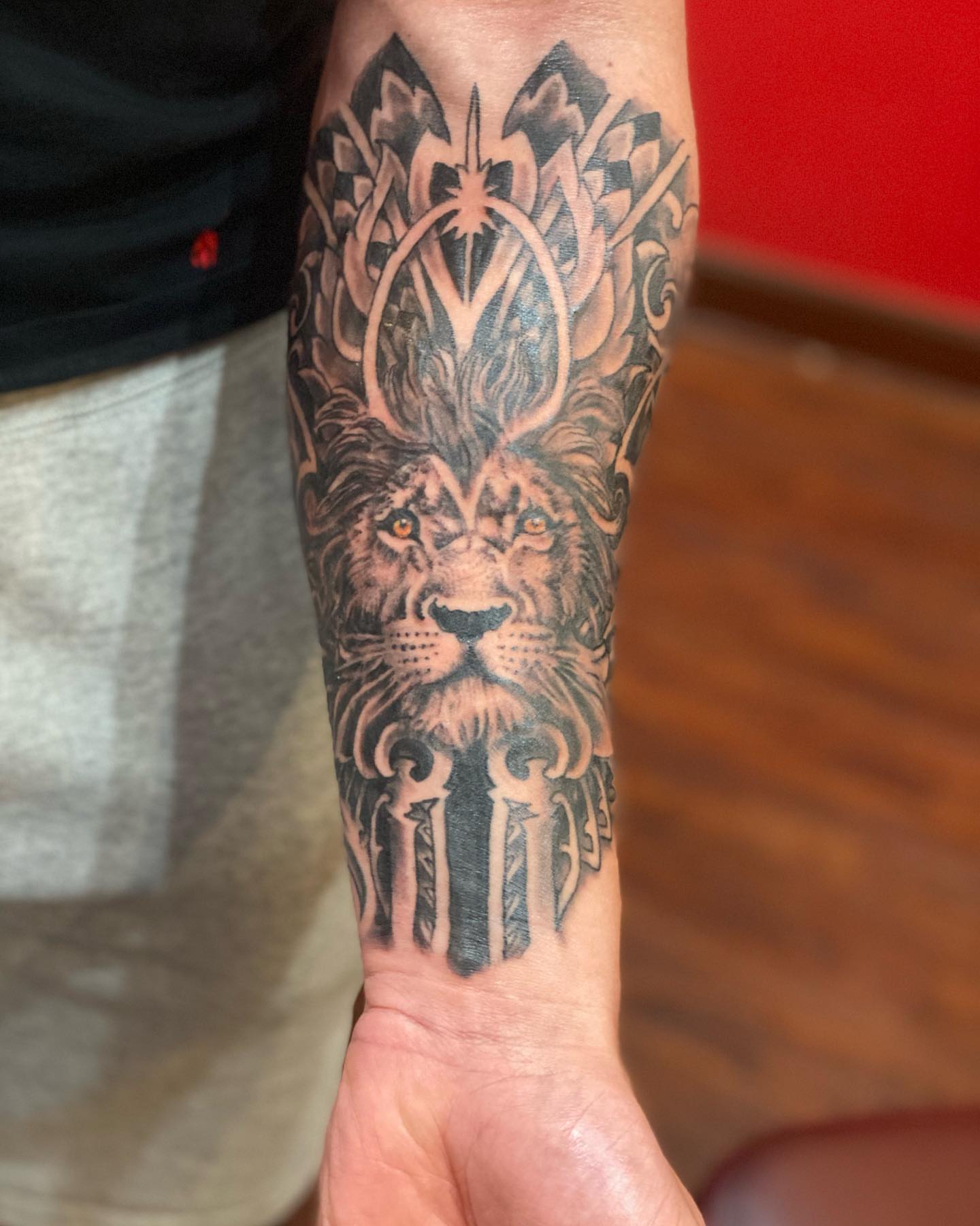 Lion realism tattoo on the forearm by Christopher Sanders