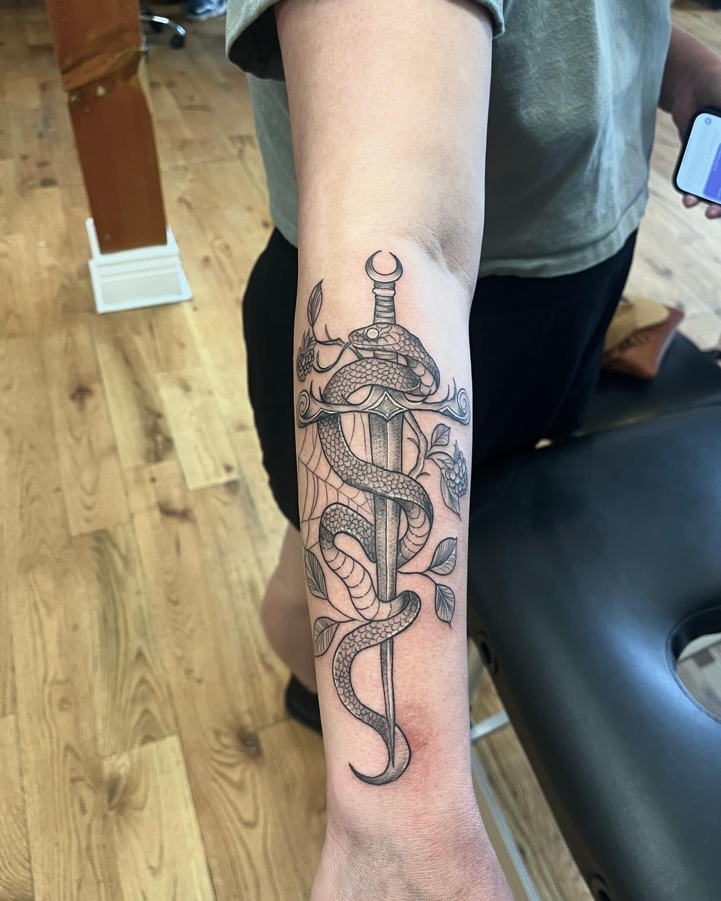 Sword and snake black and grey tattoo on the forearm by ᥴꫝꪶꪮꫀ 𝘬ꪶꫀ𝓲ꪀ ❤️‍🔥, Denver, Colorado