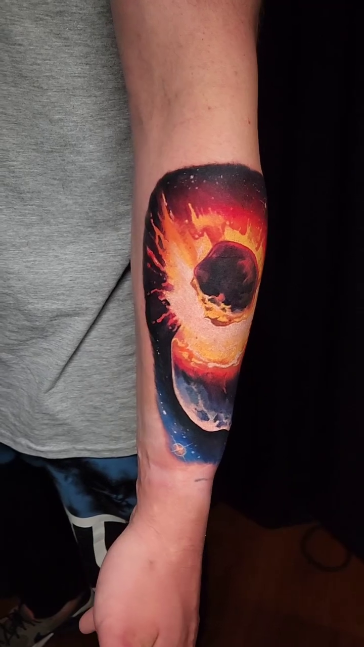 Black hole and nebula realism tattoo by Tyler Malek