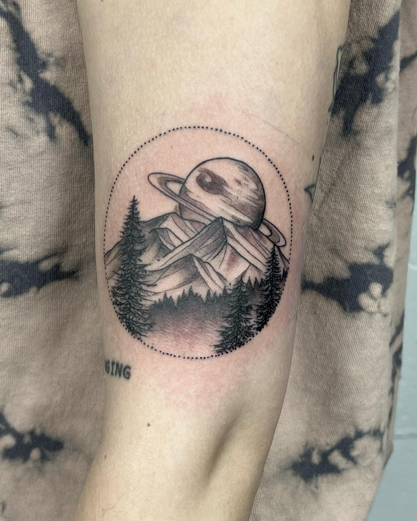 Space landscape realism tattoo on the forearm by Drew Foster, Toledo, Ohio