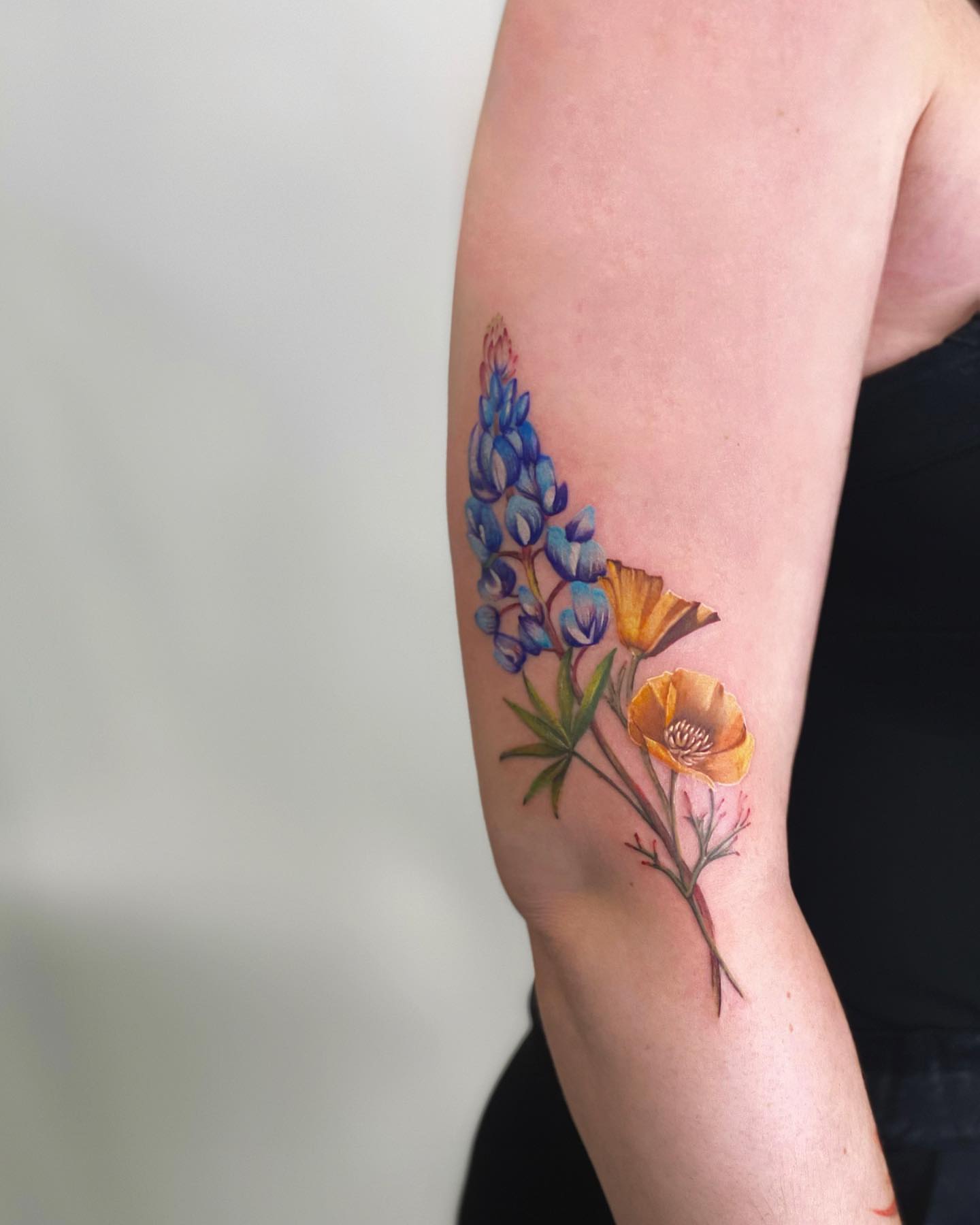 Bluebonnet and poppy realism tattoo on the forearm by Seattle Tattoo Artist PingPing, Seattle, Washington