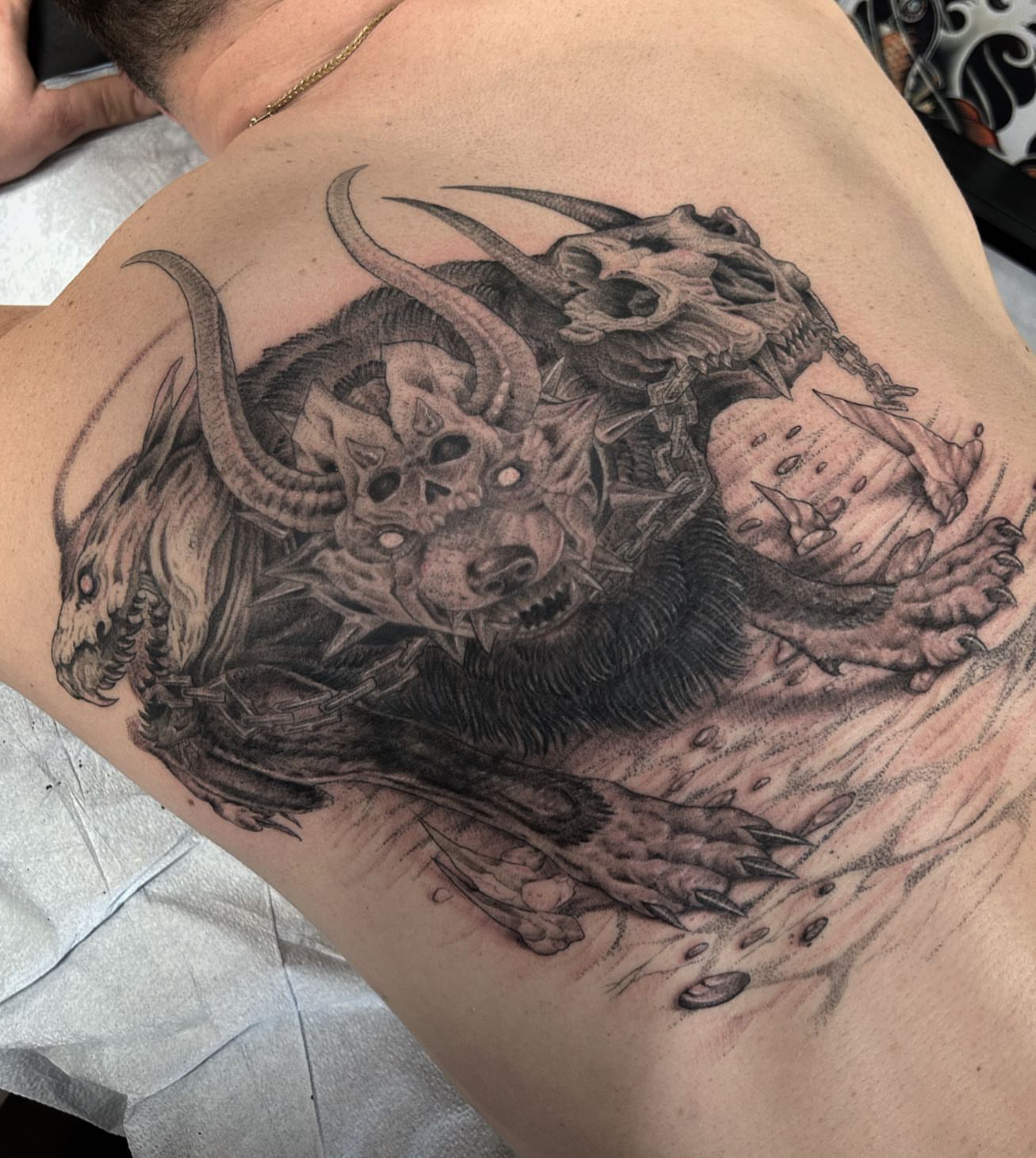 Demon dotwork tattoo on the shoulder by Pat Moser