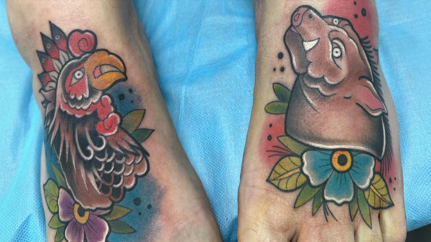 Rooster and dog American traditional tattoo on the foot by Pablo Venegas