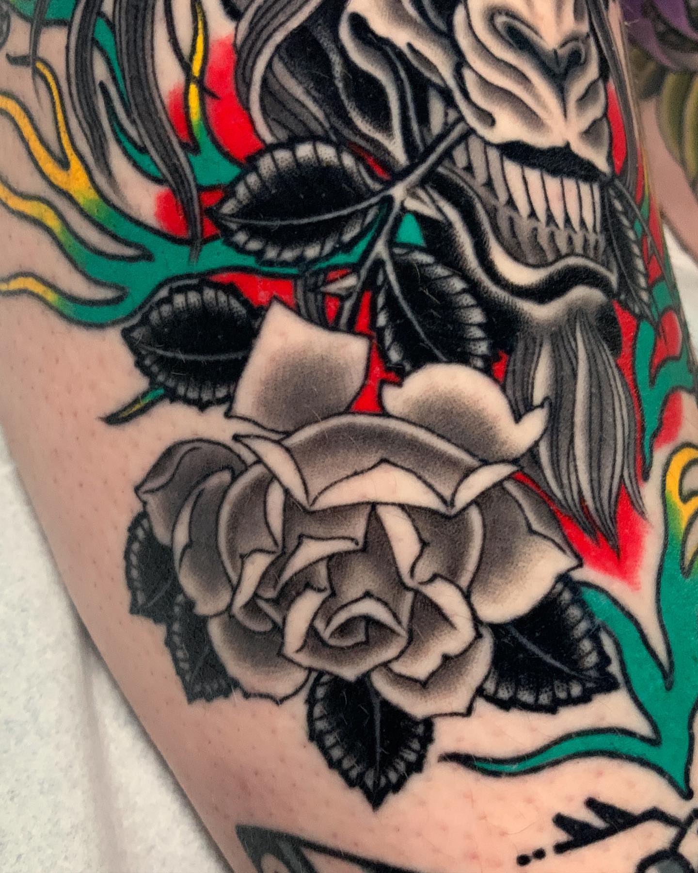 Rose and skull American traditional tattoo on the forearm by Adam Mir