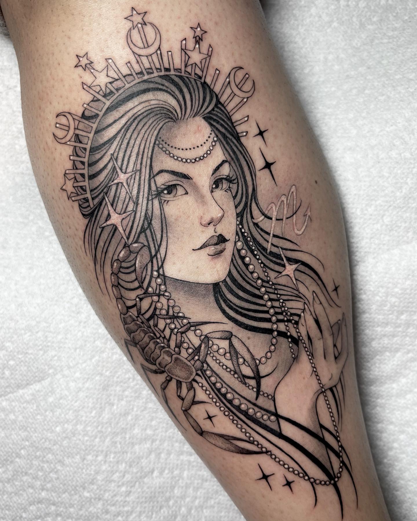 Woman with celestial motifs realism tattoo on the forearm by Kelsi Steffensen