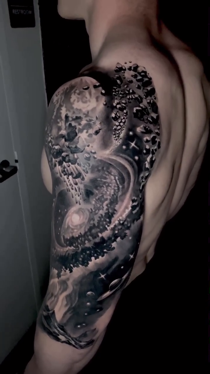 Cosmic scene realism tattoo by Sean Flood